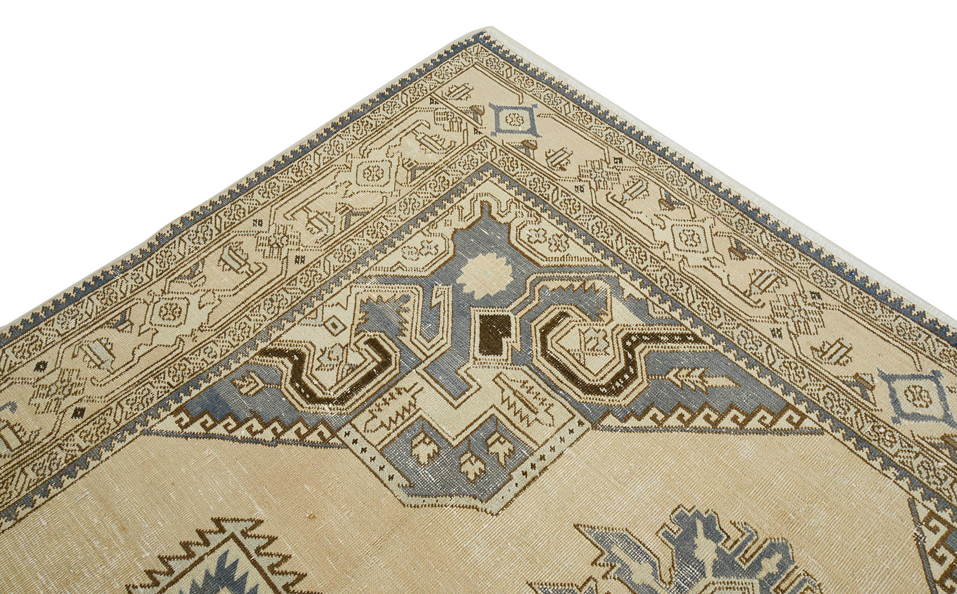 Close-up details of vintage Persian Tabriz carpet showing wool texture, motifs, and natural patina
