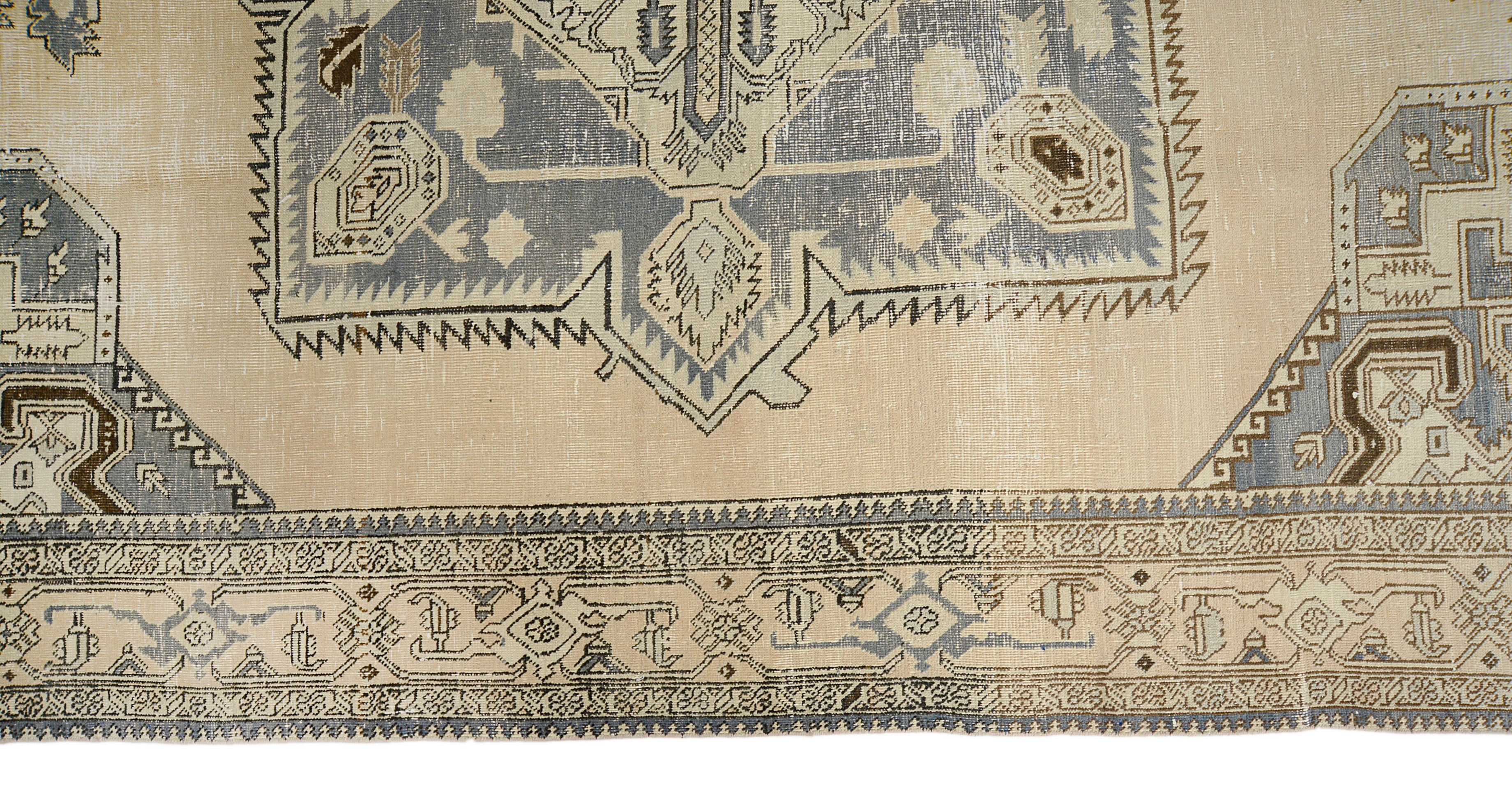 Close-up details of vintage Persian Tabriz carpet showing wool texture, motifs, and natural patina
