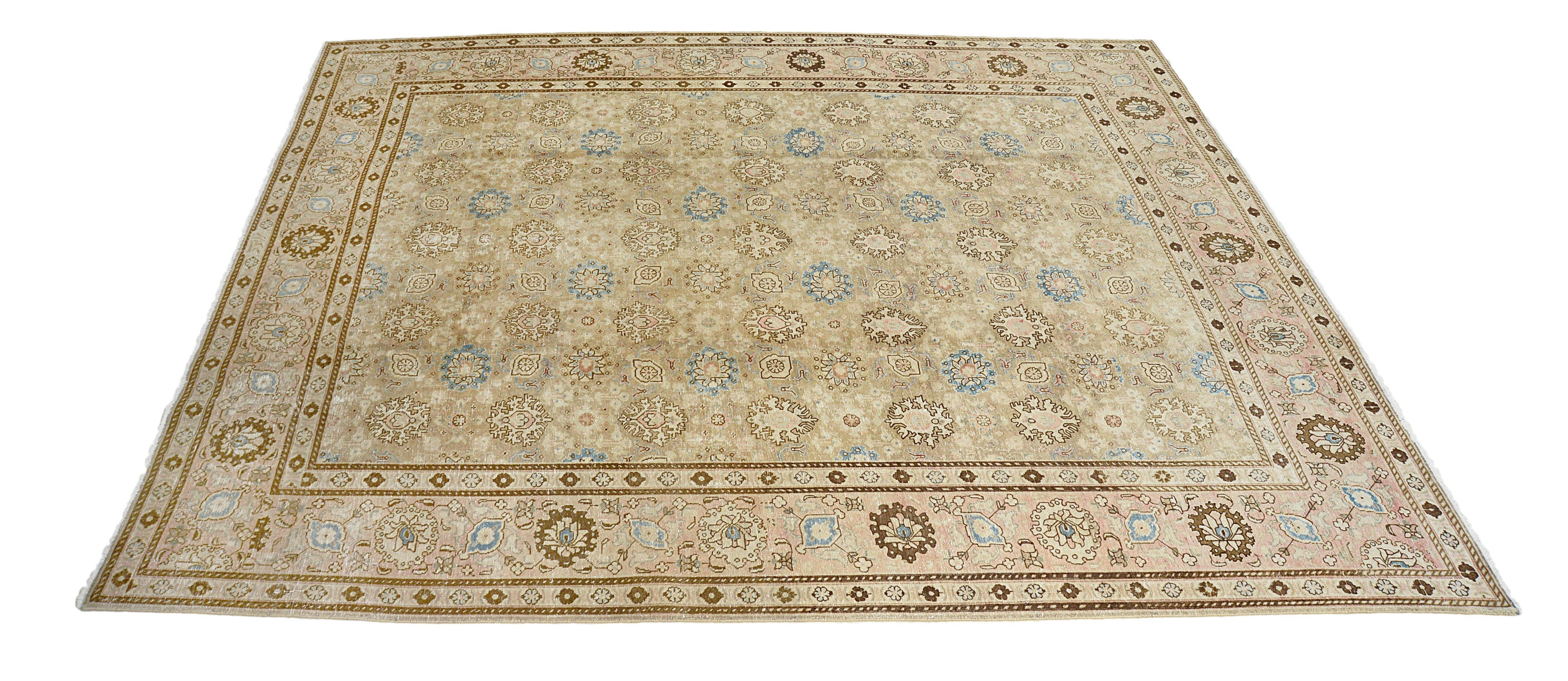 Hand-knotted vintage Persian Tabriz carpet with elegant all-over floral design and soft tones
