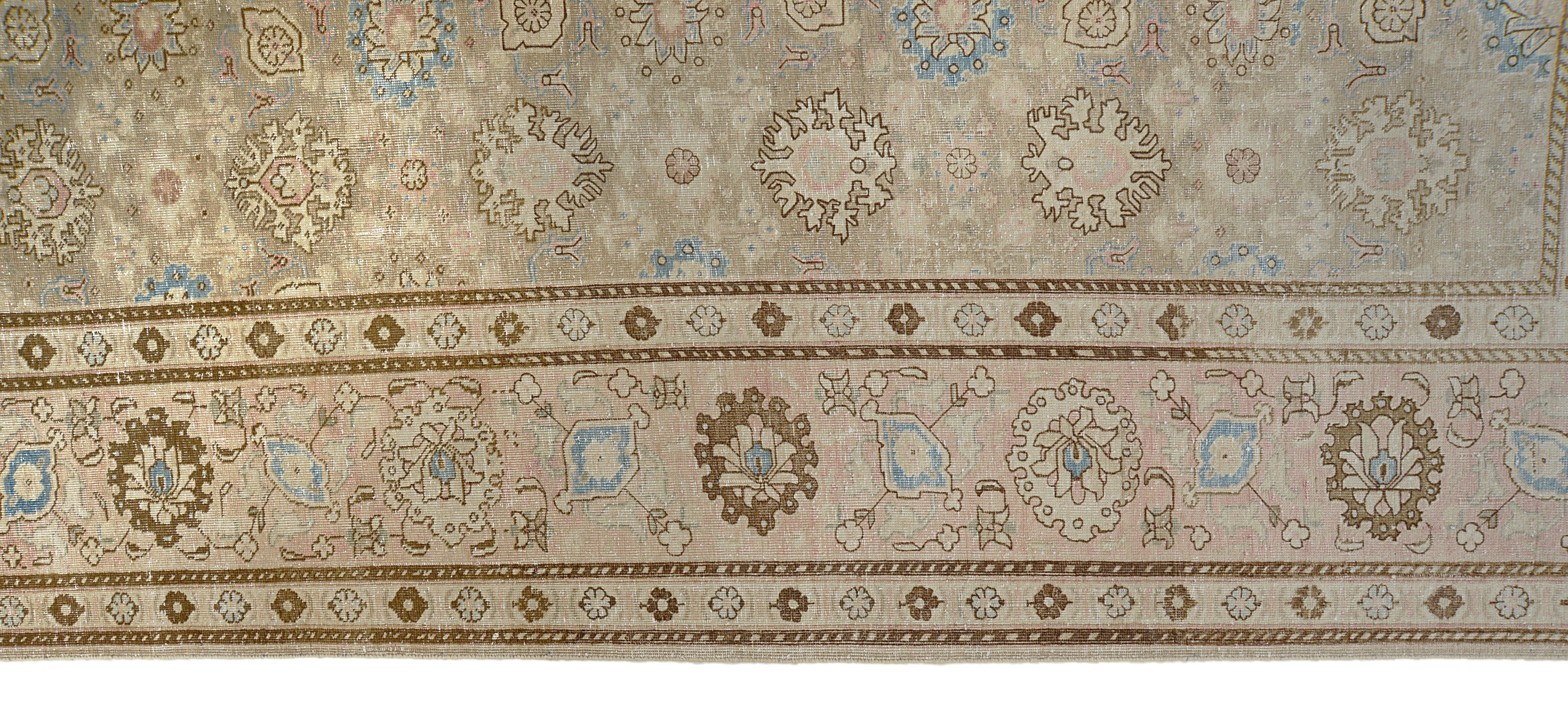 Close-up details of vintage Persian Tabriz carpet showing wool texture, borders, and natural patina
