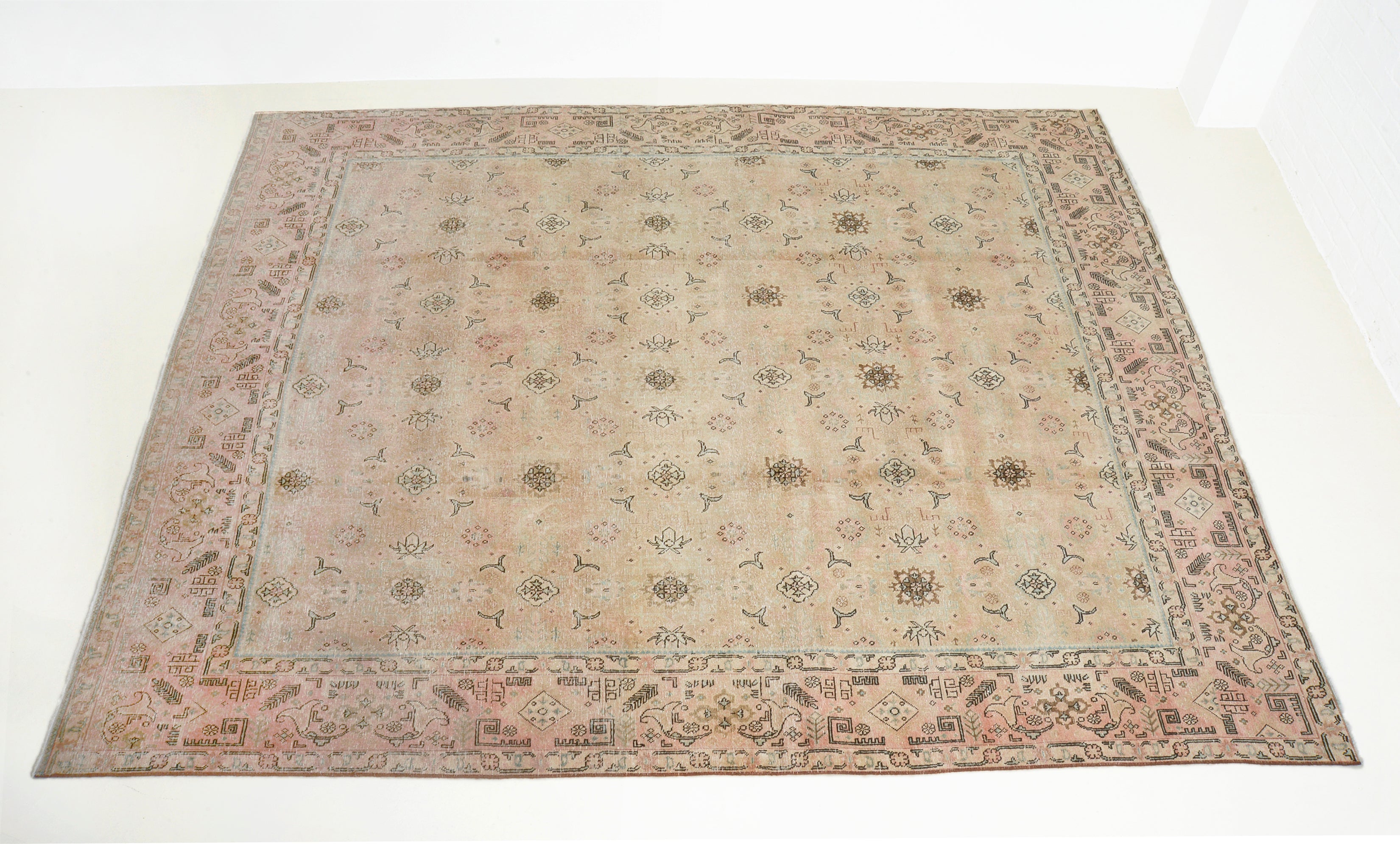 Hand-knotted vintage Persian Tabriz carpet with soft all-over pattern and aged neutral tones
