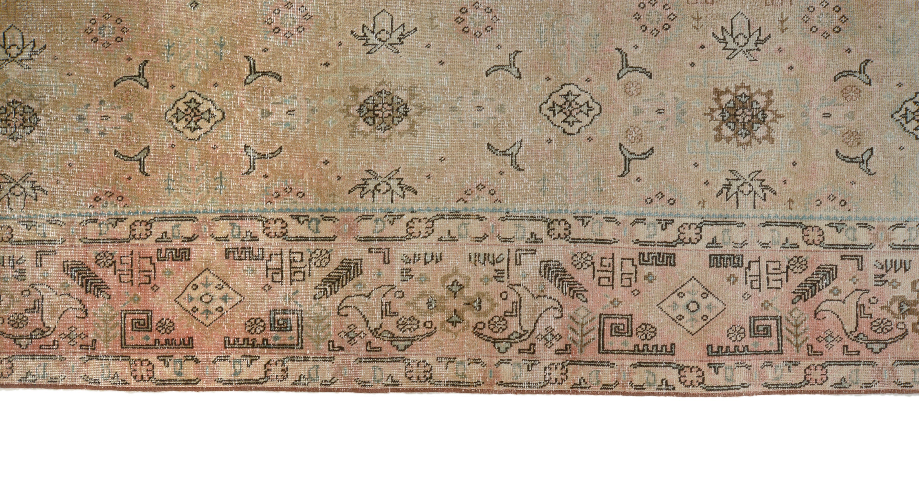 Close-up details of vintage Persian Tabriz carpet showing wool texture, borders, and natural patina
