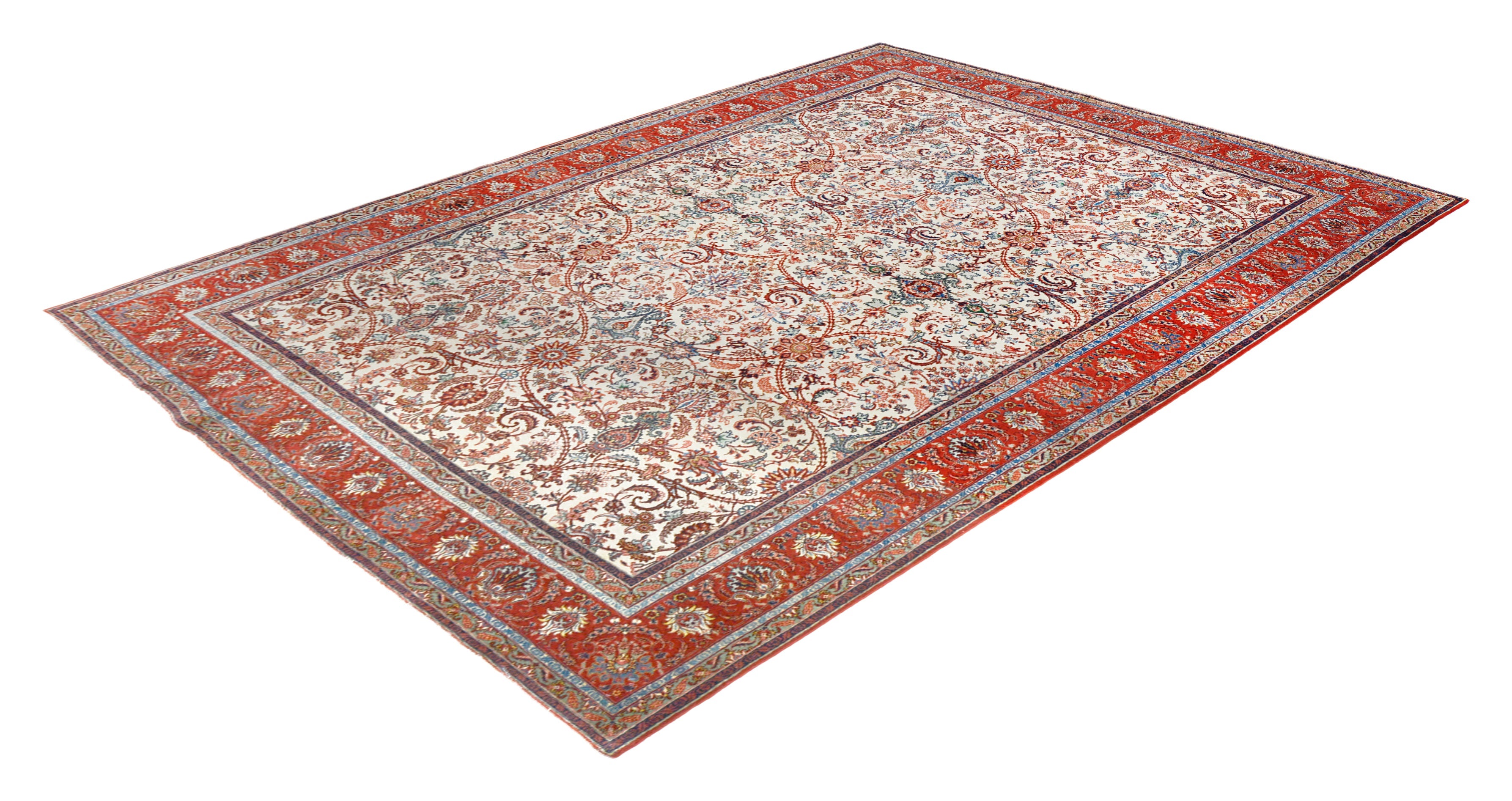 Hand-knotted antique Tabriz rug with all-over floral design and rich natural colours
