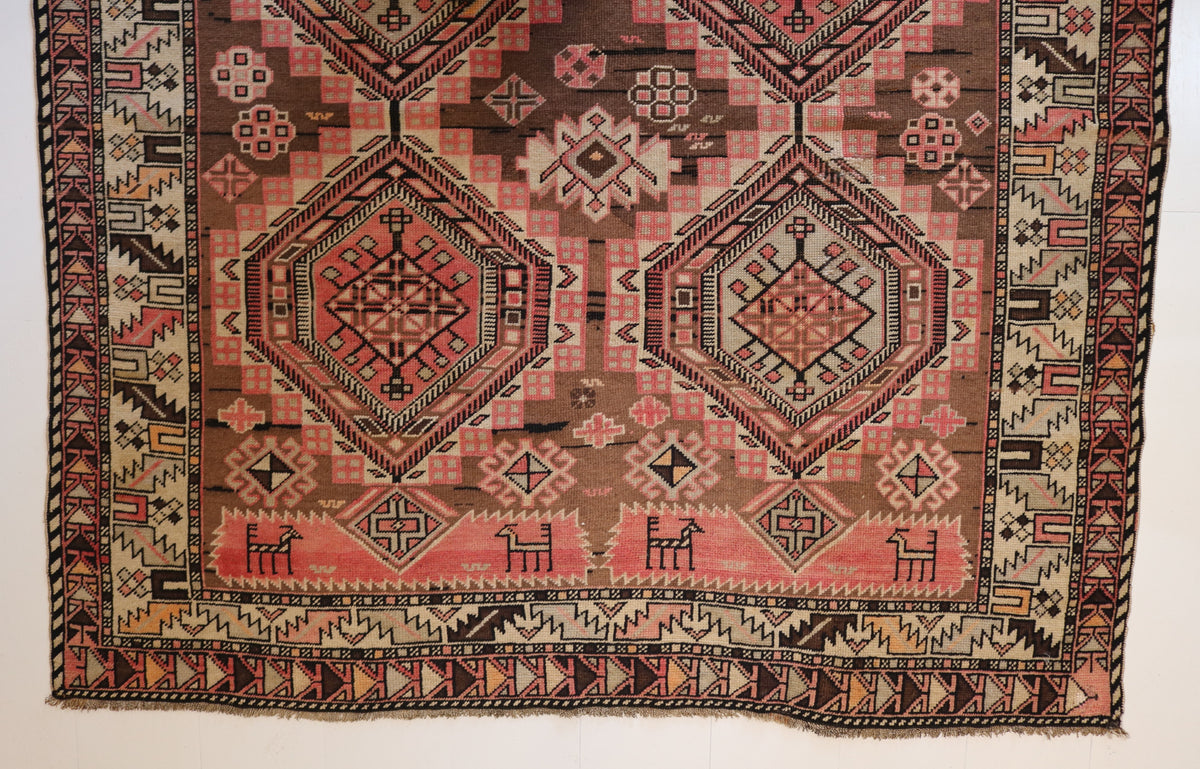 Close-up of geometric medallion surrounded by intricate patterned field