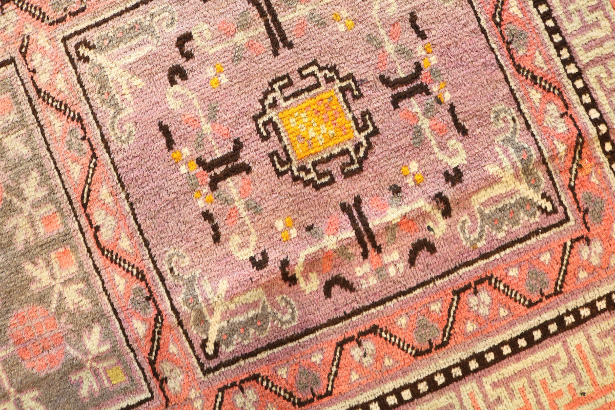 Close-up of geometric panel with floral detailing and warm yellow accents