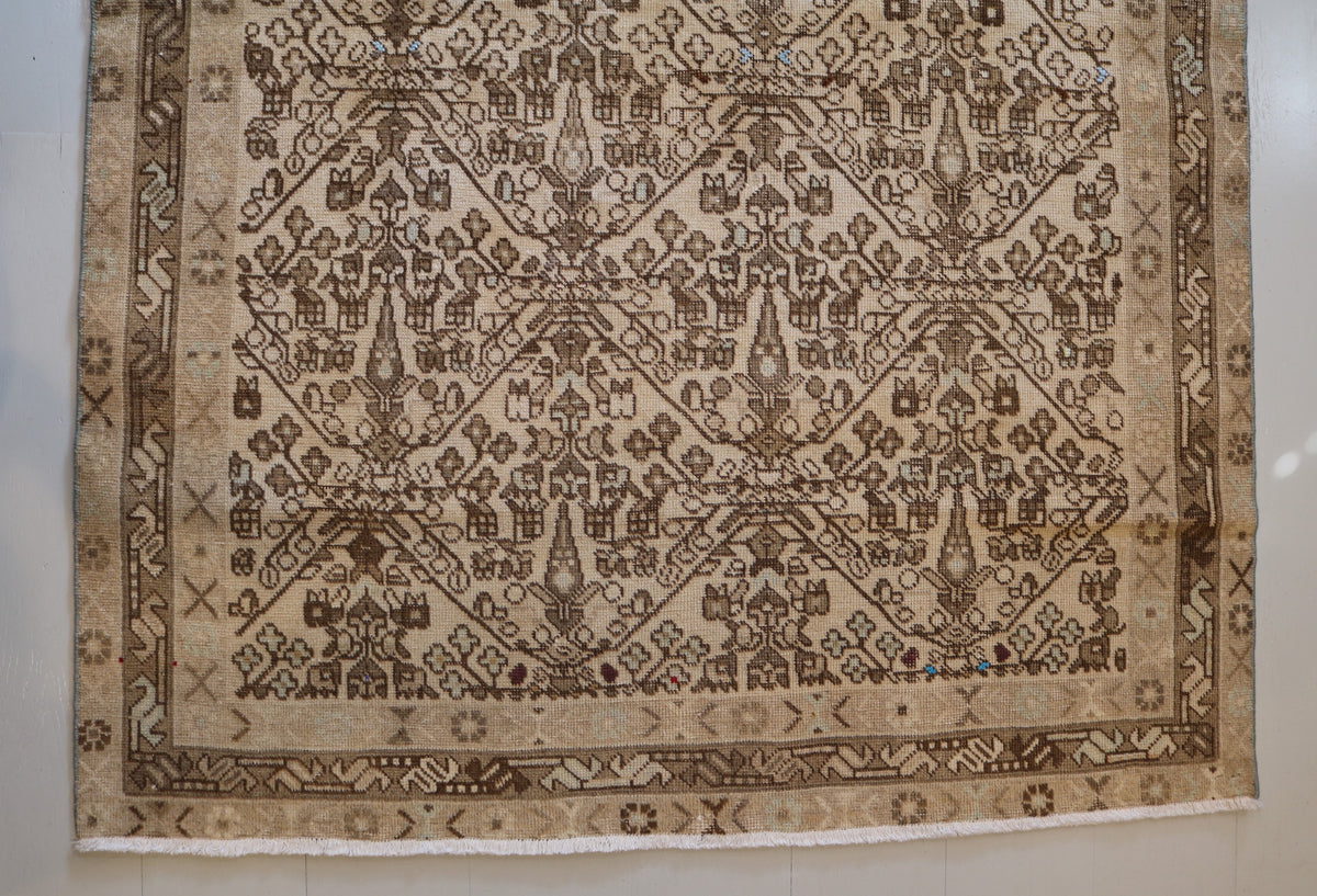 Angled view of rug showing the overall geometric composition