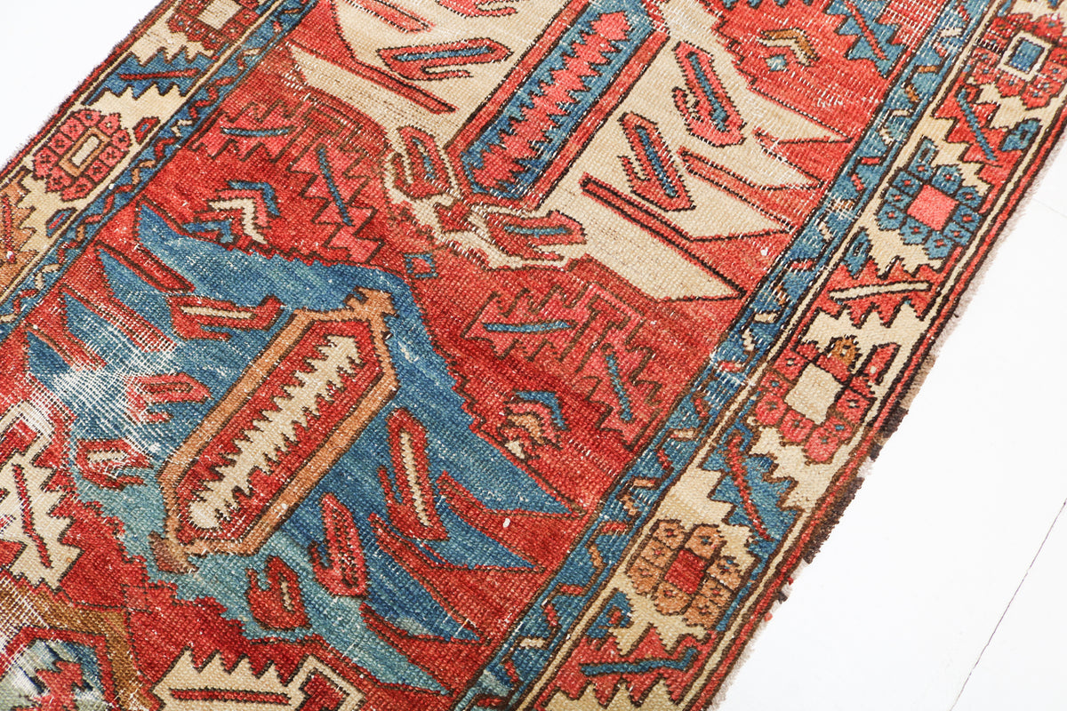  Close-up of the geometric design and decorative border of an antique Persian runner rug