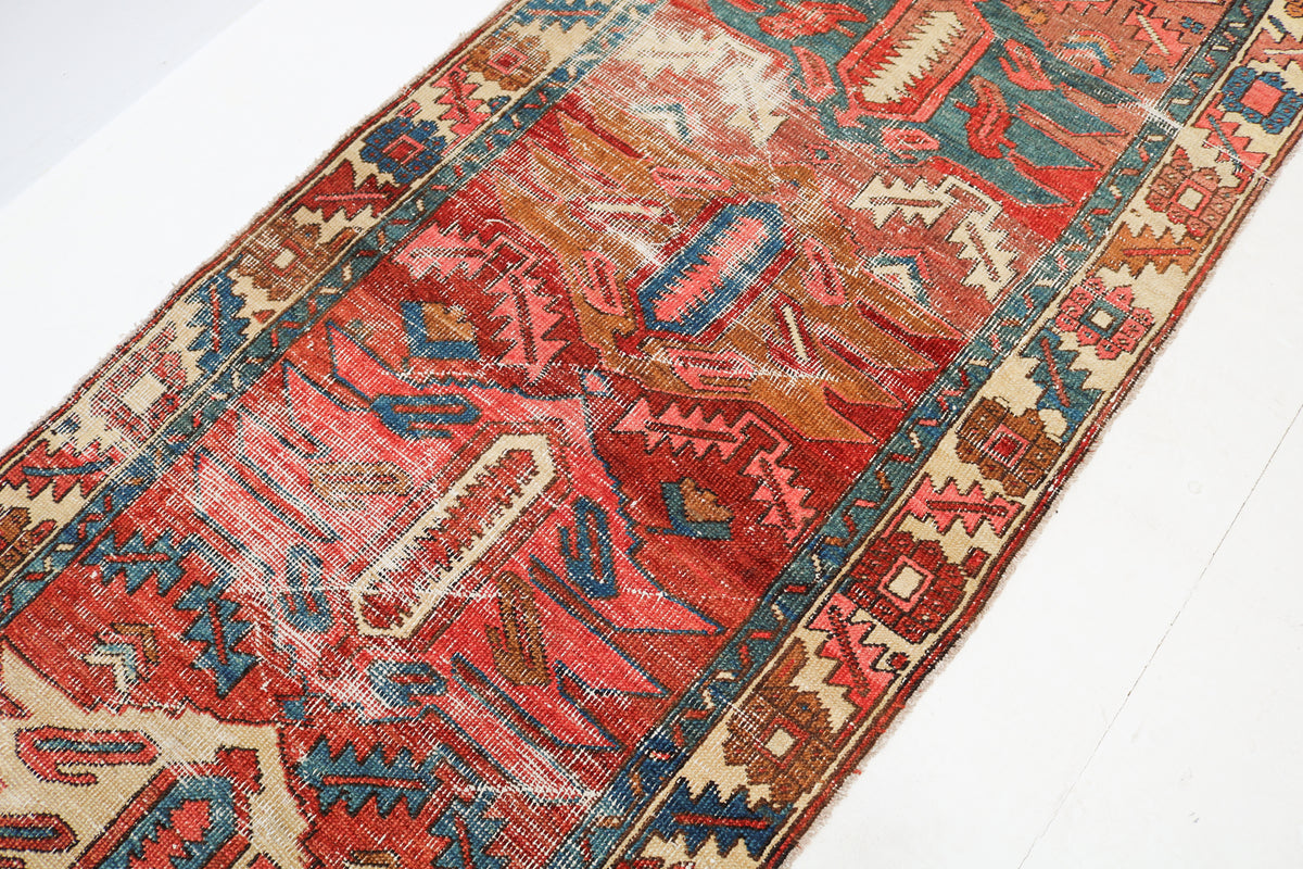  Antique Persian runner rug with traditional geometric patterns in red, blue and ivory tones