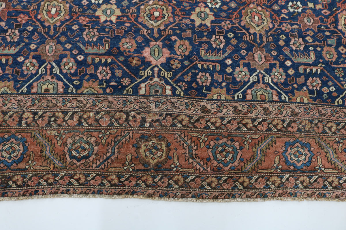 Close-up of Bakshayesh carpet border with intricate floral and geometric details