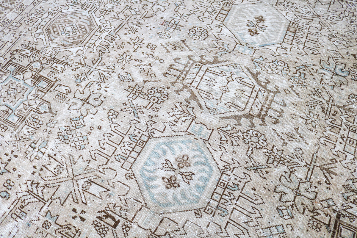 Detailed Persian carpet field with intricate geometric patterns and naturally aged colours