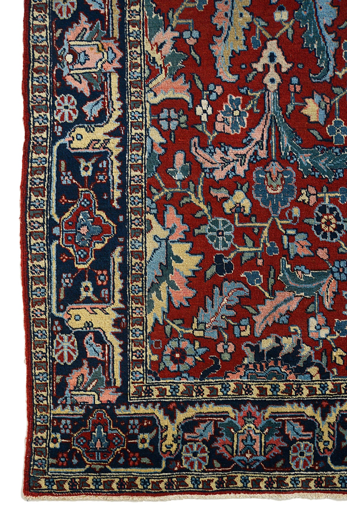 Antique Persian Heriz carpet with deep red field, floral motifs and dark blue border