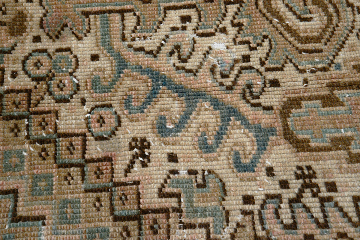 Detailed view of antique Persian Heriz carpet with angular geometric patterning