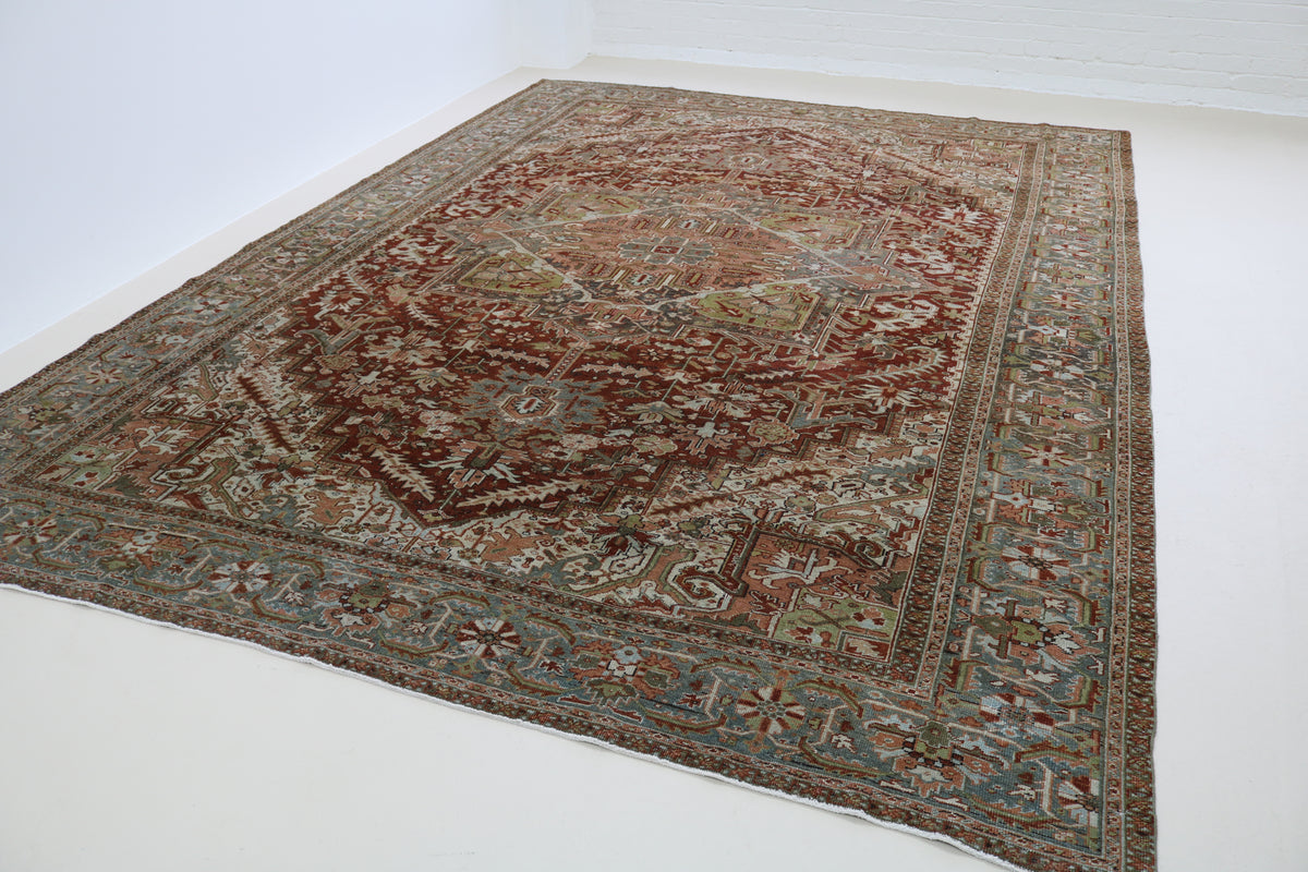 Angled view of Heriz carpet showing central medallion and detailed floral design