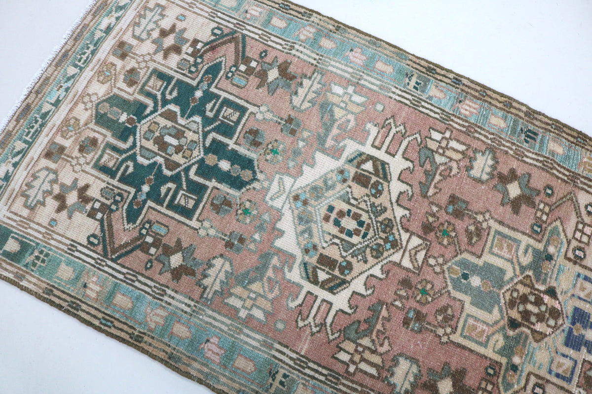 Close-up of Heriz runner with large geometric motifs and intricate patterned details