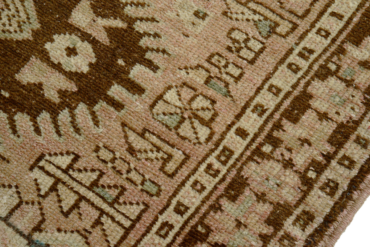 Detailed view of Persian Heriz runner border with repeating geometric pattern