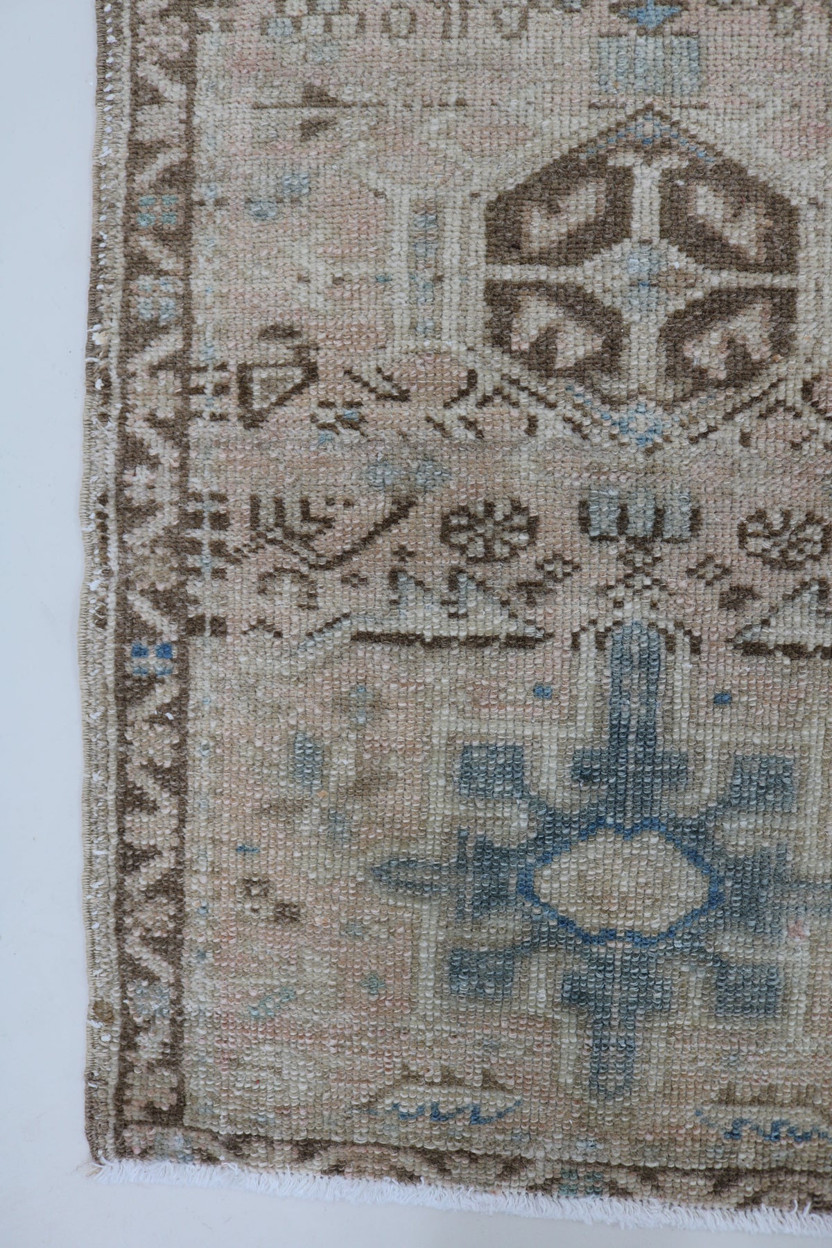 Antique Persian Heriz runner with muted beige field and blue geometric motifs
