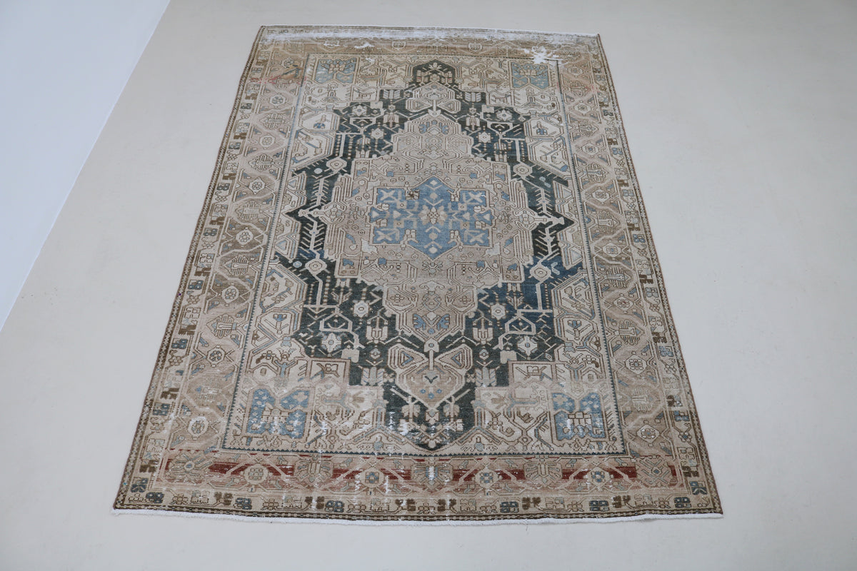 Full view of antique Persian Karaja carpet with striking geometric design and contrasting tones
