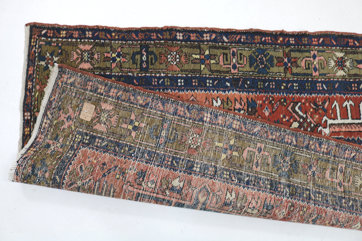 Folded Karaja runner showing patterned reverse and detailed woven border