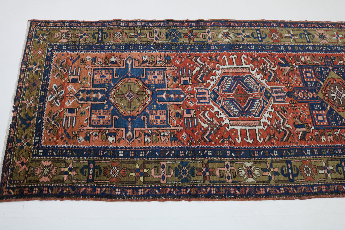 Detailed runner section with stepped geometric medallions and richly patterned borders