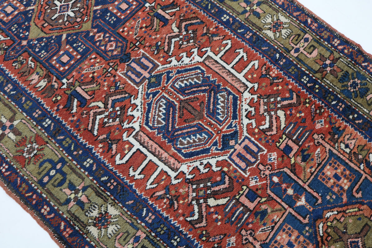 Close-up of Persian Karaja rug showing intricate central medallion and tribal patterns