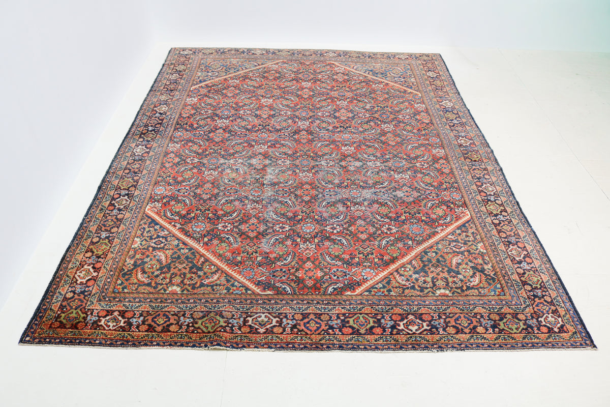 Full view of antique Persian Mahal rug with richly detailed all-over floral design
