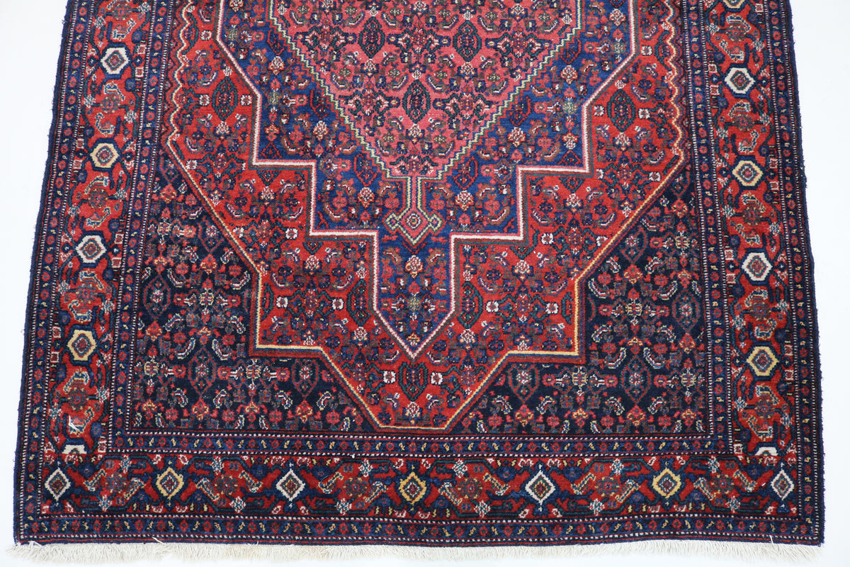 Persian Senneh rug with central geometric design and intricate patterned borders