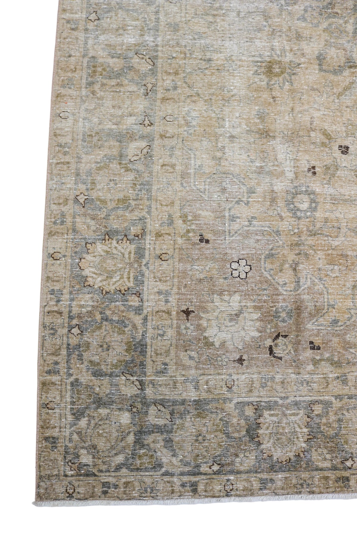 Antique Persian Tabriz carpet with faded floral motifs and muted beige tones