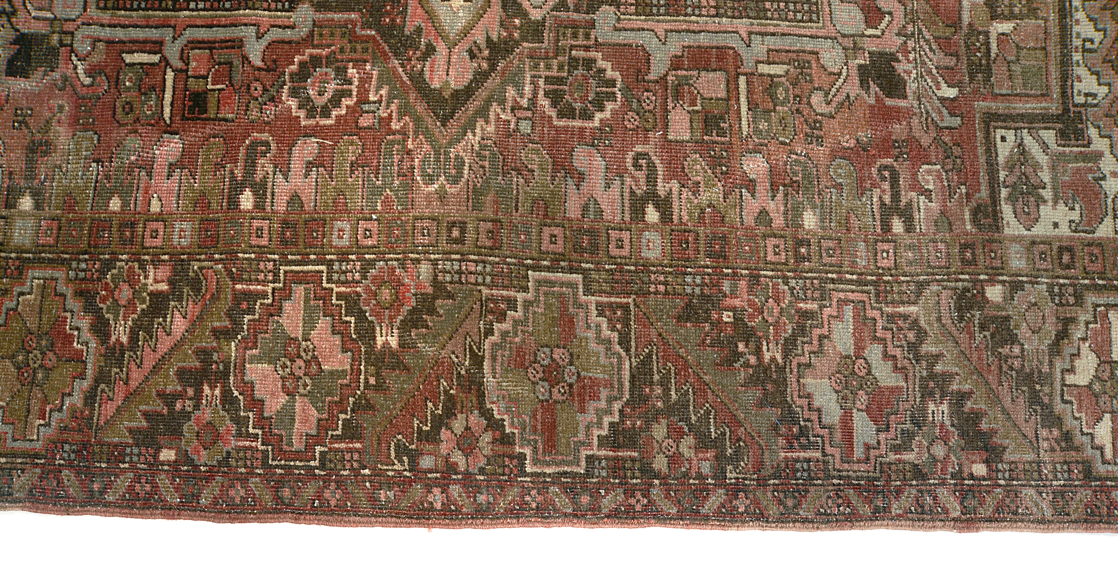 Close-up of border design on antique Persian Heriz carpet
