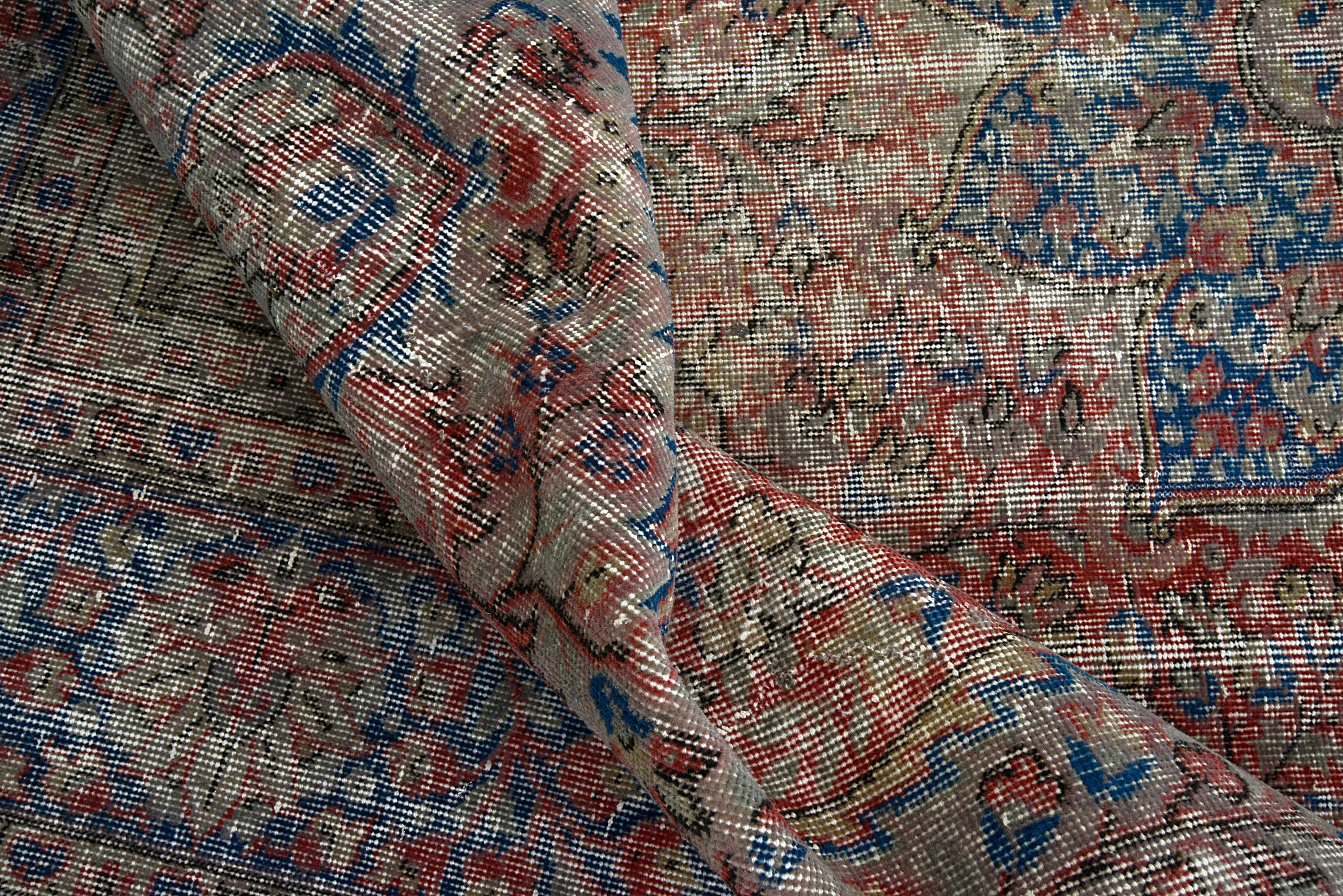 Close-up of hand-woven wool texture on vintage Turkish carpet
