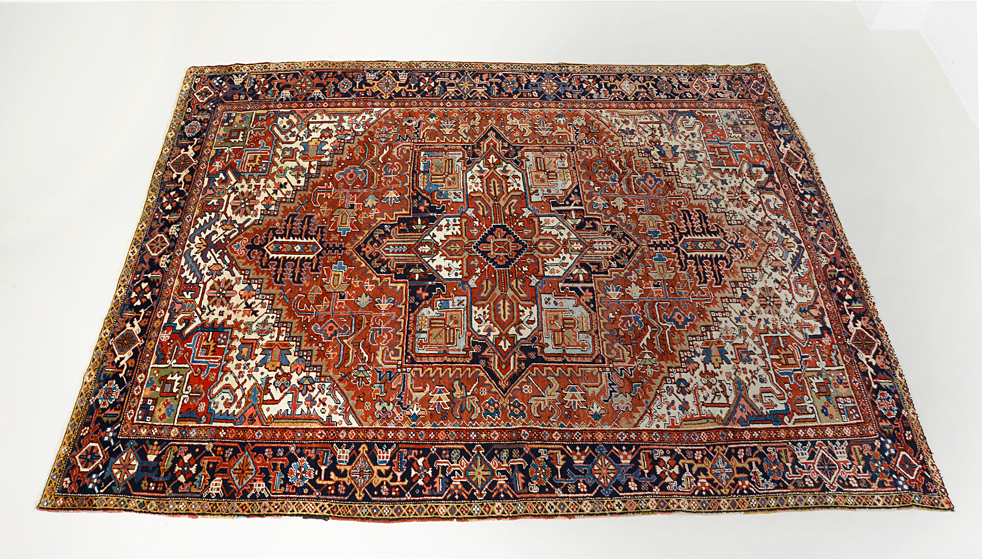 full view of  central field design on an antique Persian Heriz carpet

