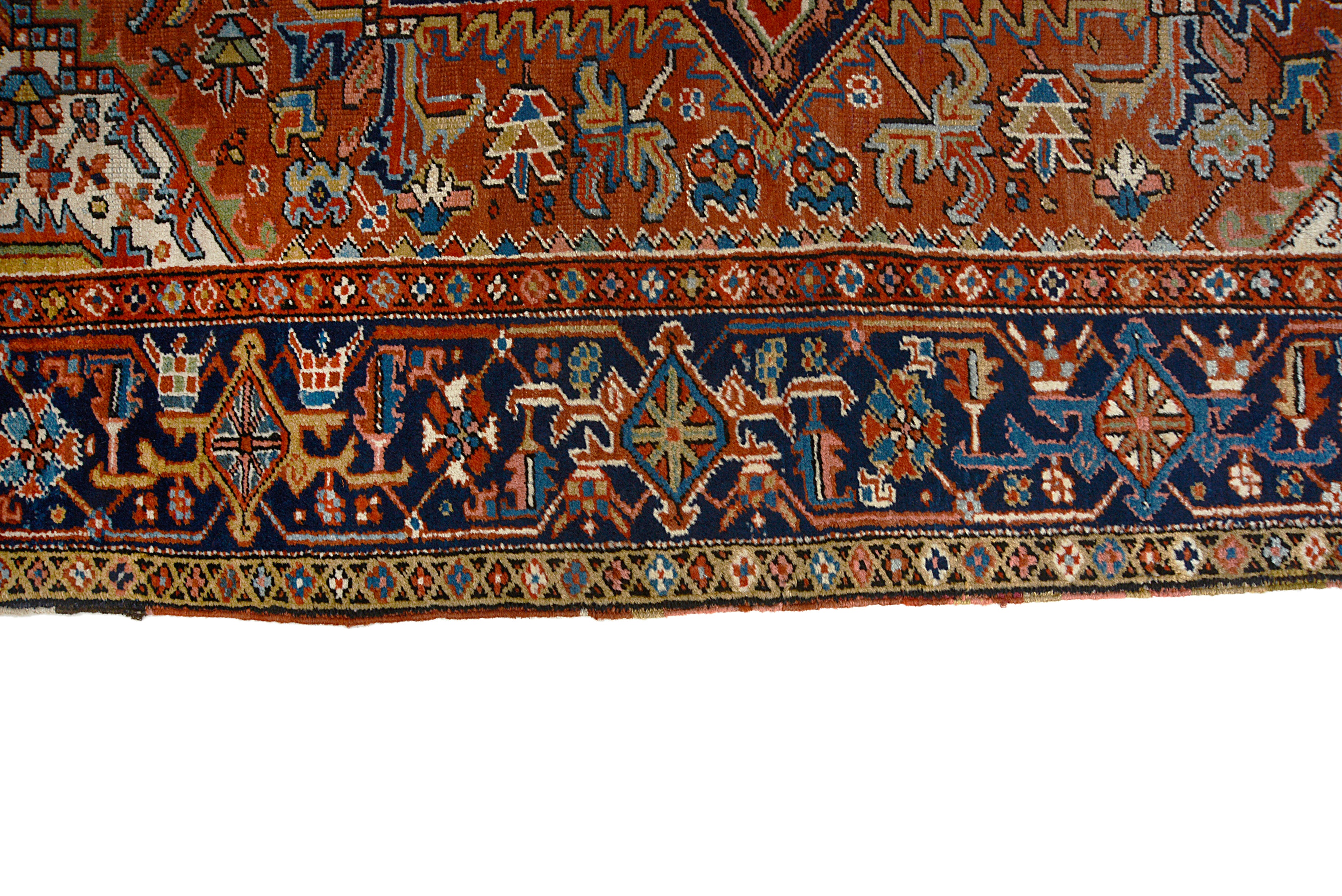 Border detail of an antique Persian Heriz carpet with strong architectural patterns
