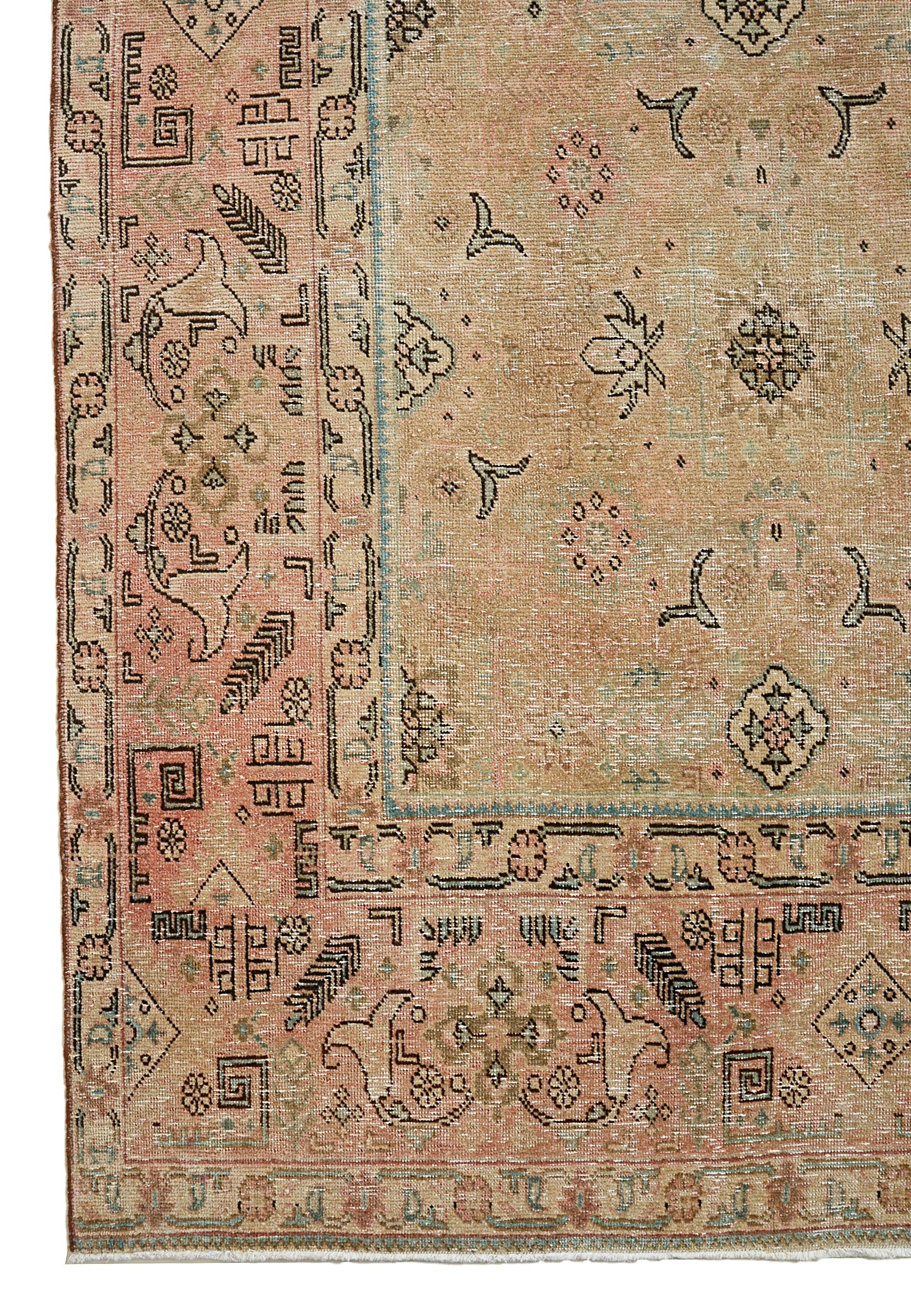 Vintage Persian Tabriz carpet corner detail showing hand-knotted wool and traditional border design
