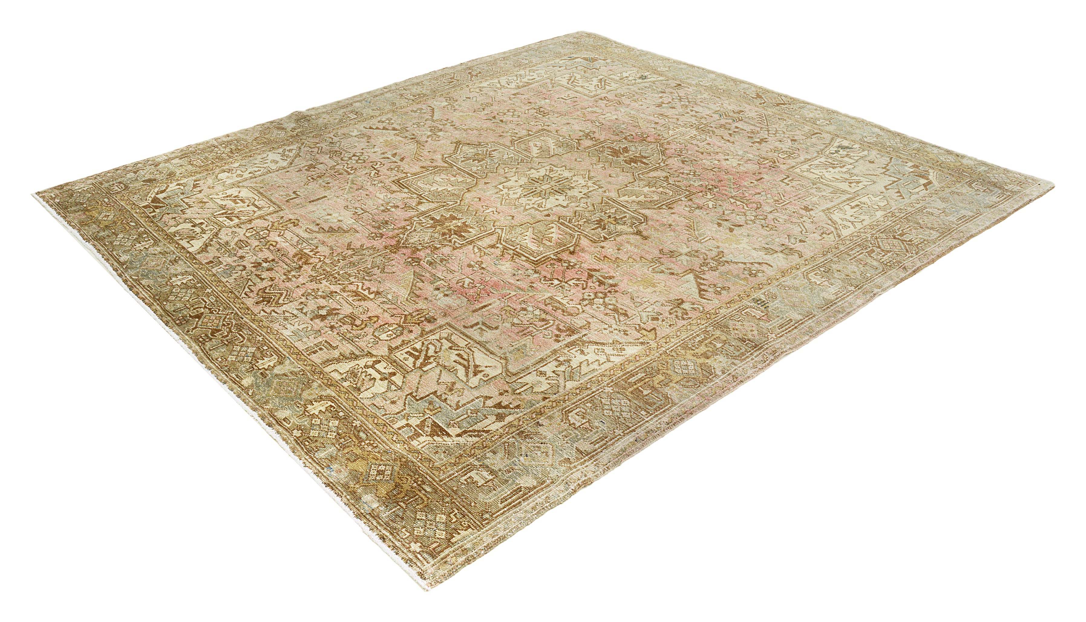 Authentic vintage Persian Heriz area rug featuring angular geometric patterns and soft faded colours, handmade wool carpet, Iran
