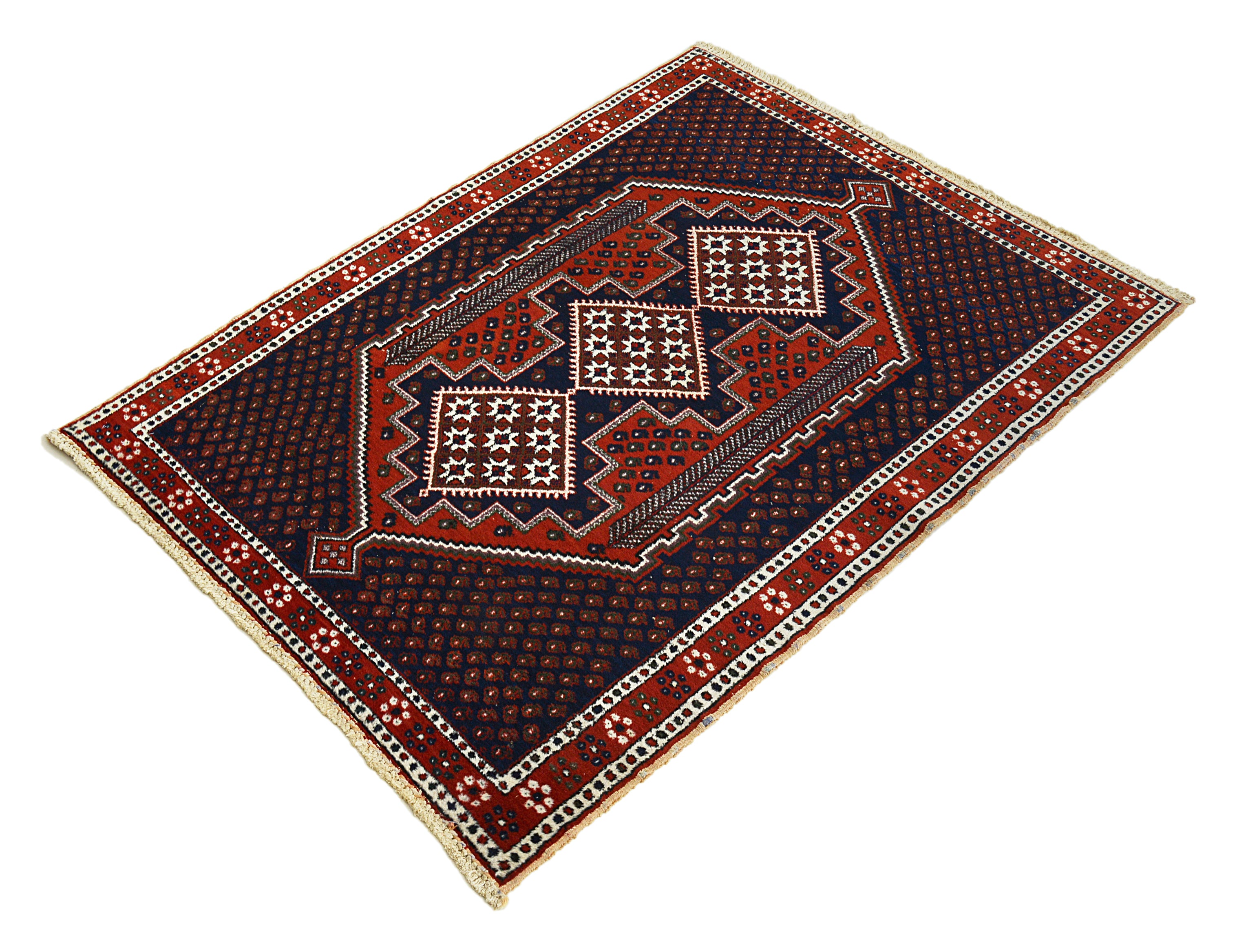 Angled view of an antique Persian Afshar rug highlighting overall geometric composition
