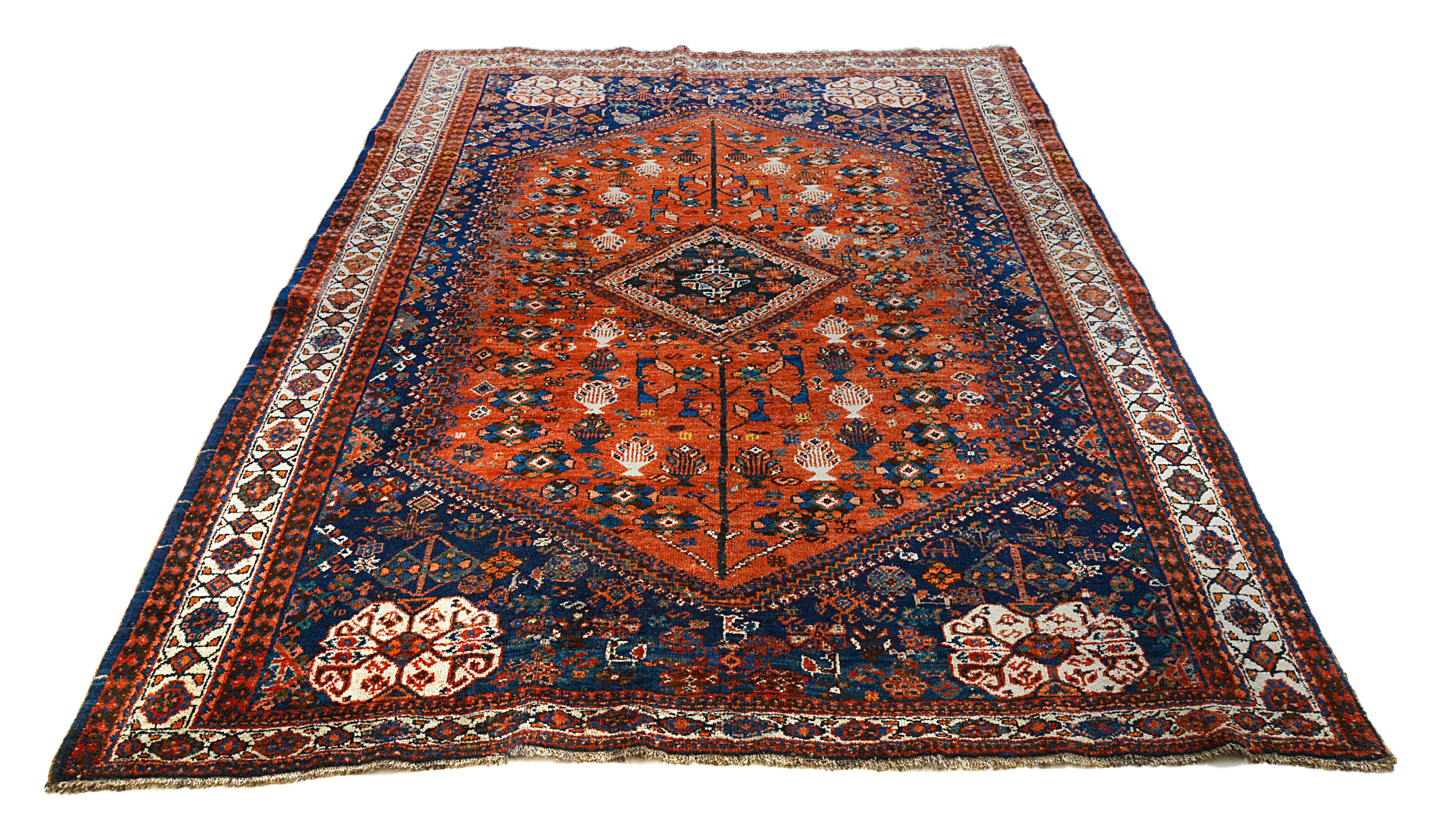 Full view of an antique Persian Qashqai carpet woven circa 1920, measuring 252 x 180 cm

