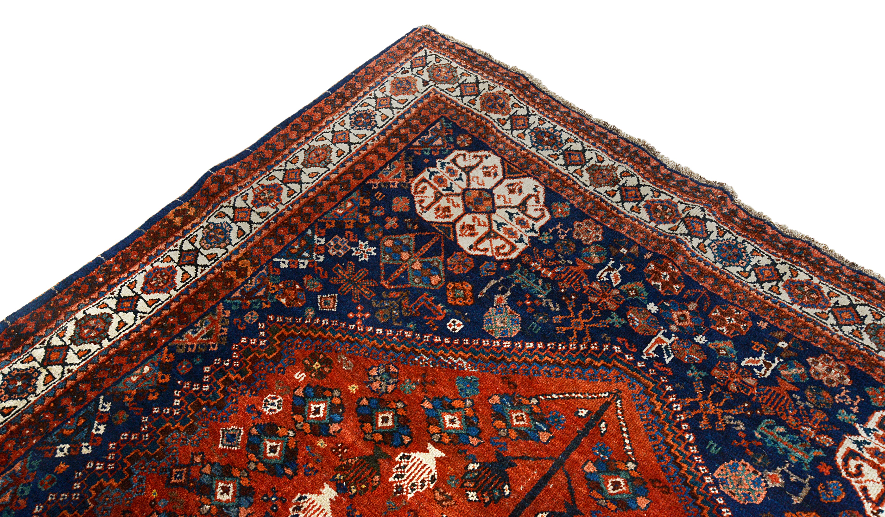 Detail of the guard borders on an antique Persian Qashqai carpet
