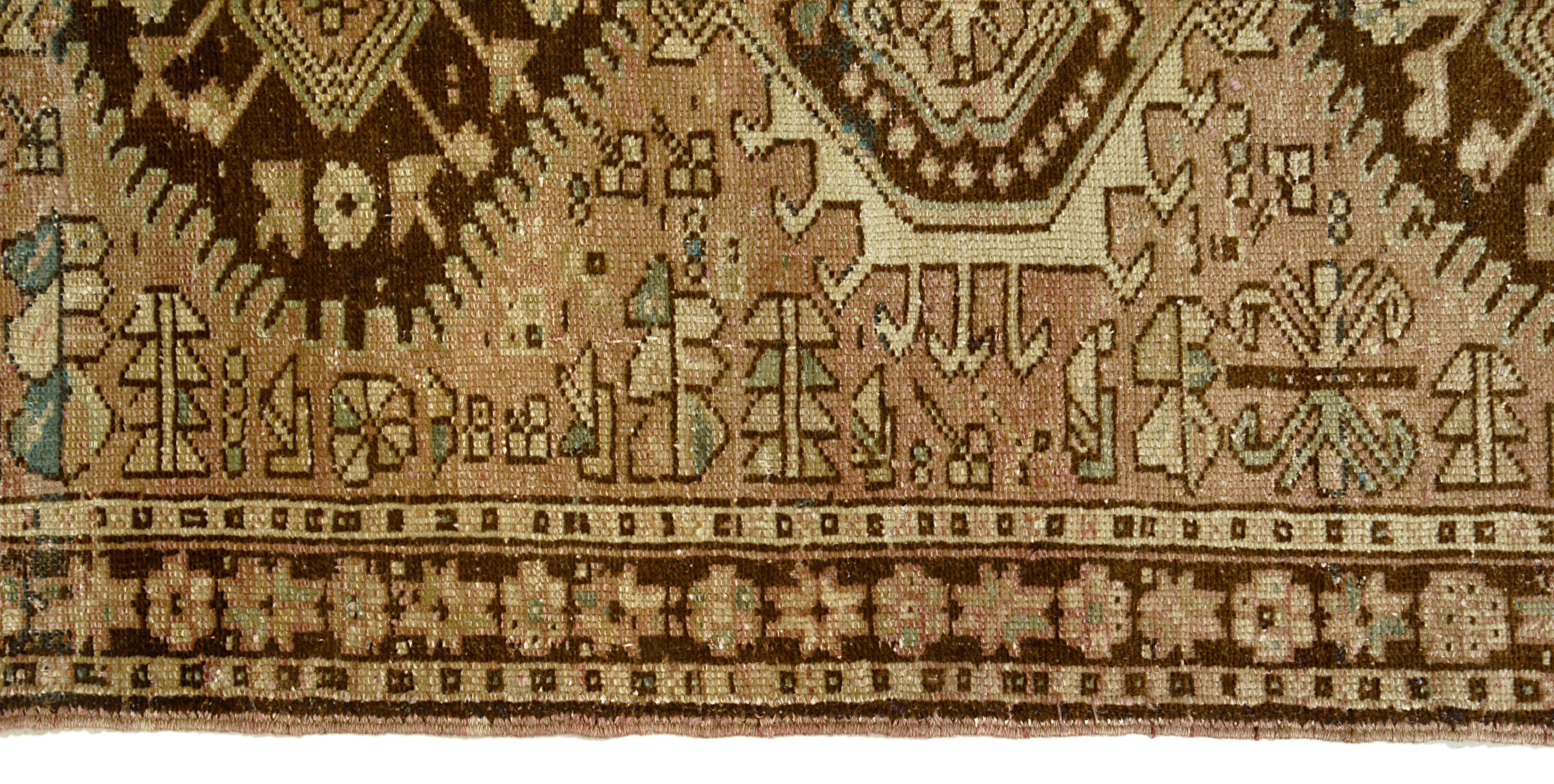Border detail of an antique Persian Heriz runner
