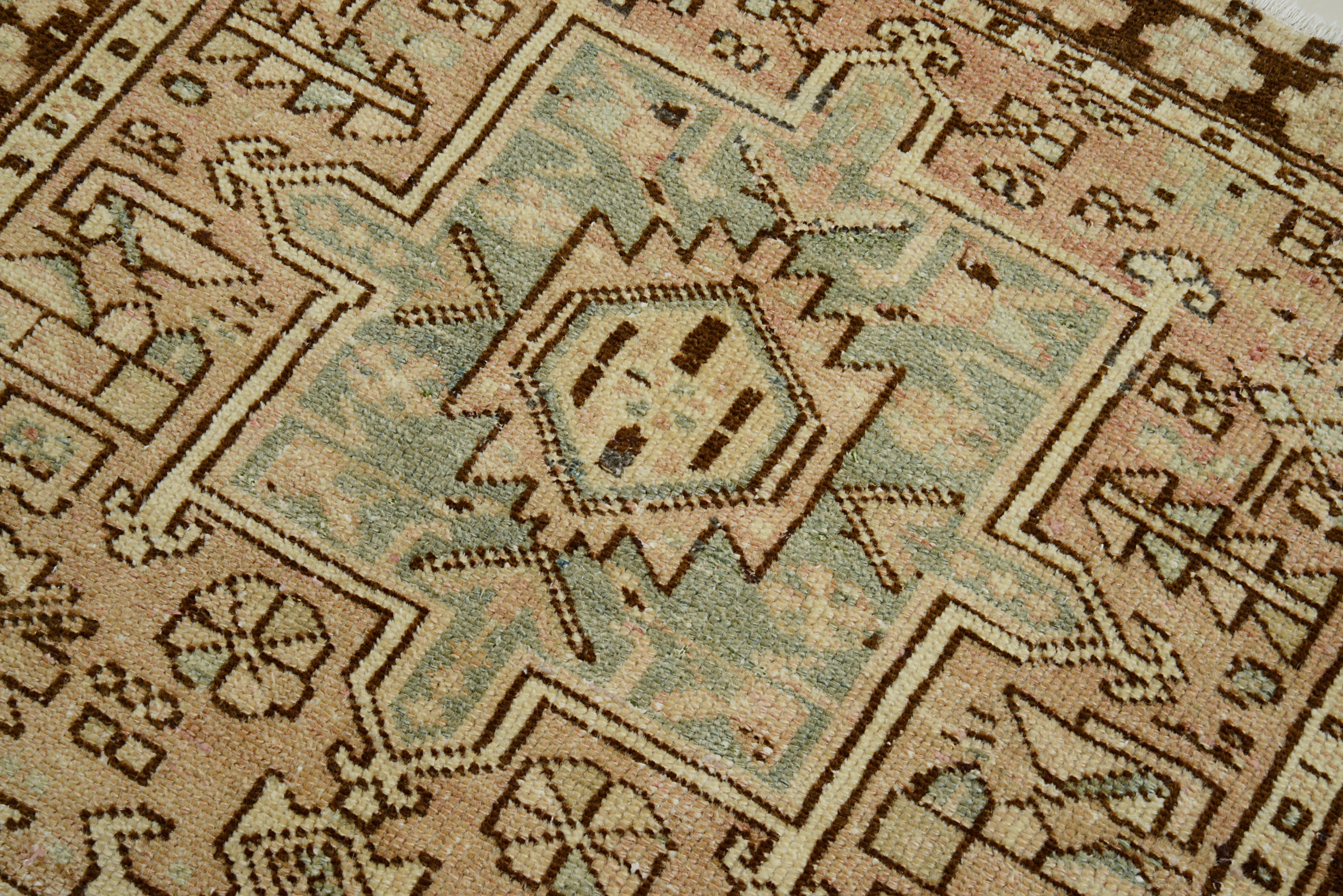 Close-up of a patterned Antique Heriz Runner with geometric designs.