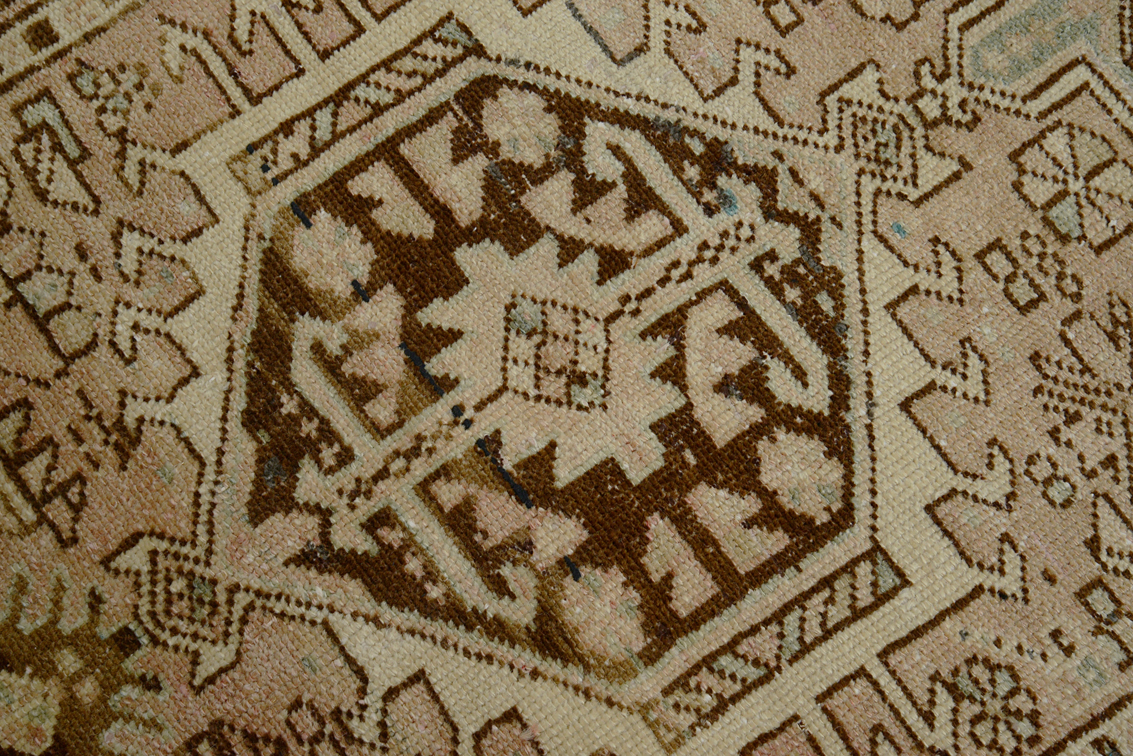 Close-up of a patterned Heriz rug with geometric design