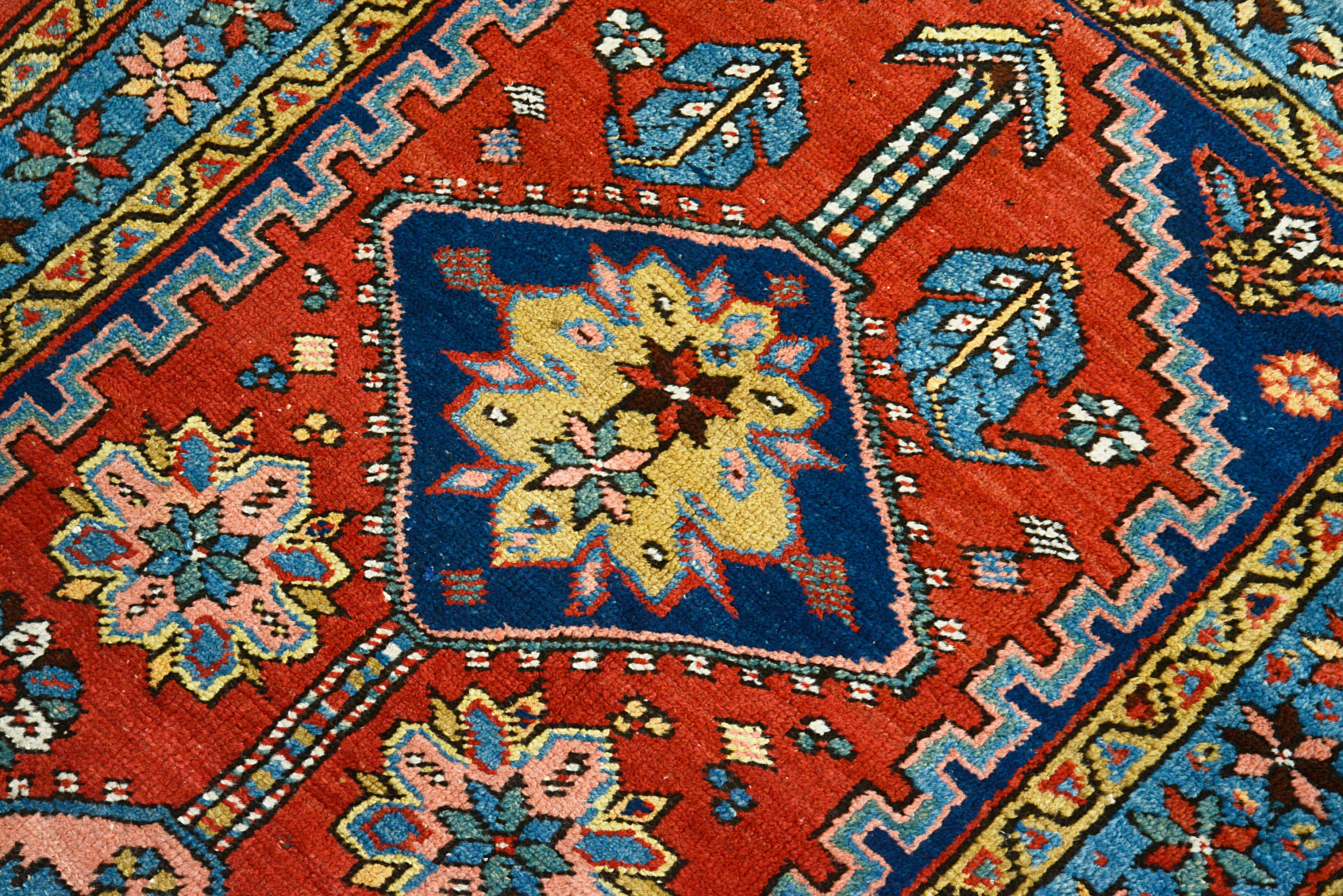 Close-up of the central field design on an antique Persian Heriz runner
