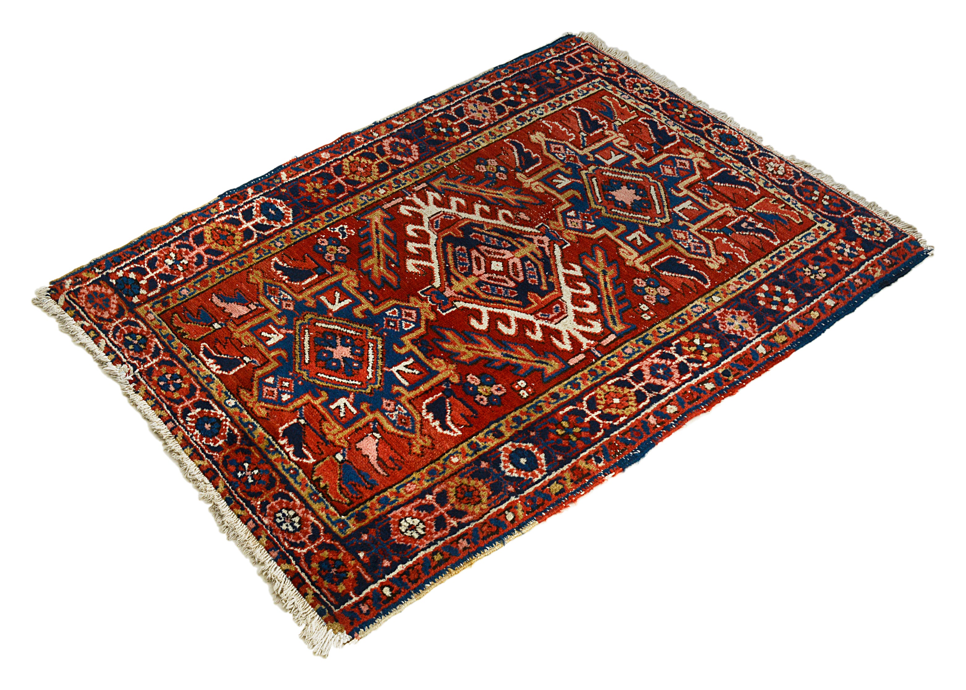 Decorative Heriz rug with intricate patterns on a white background