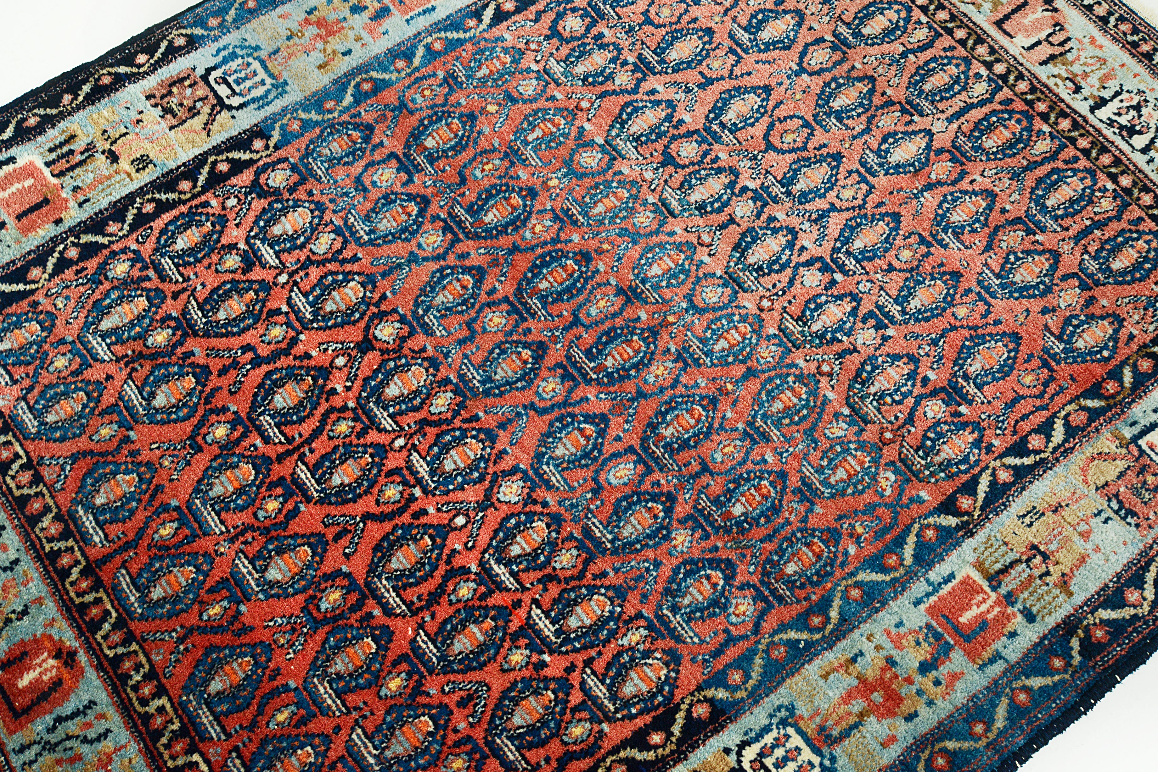 Close-up of an fine antique Persian rug with geometric design