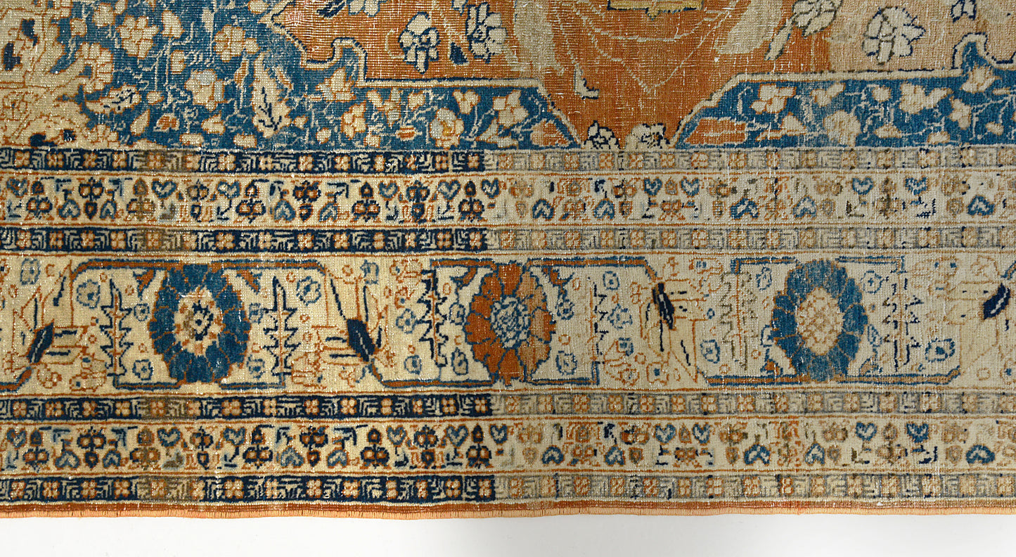 Floral border detail of antique Persian Tabriz rug