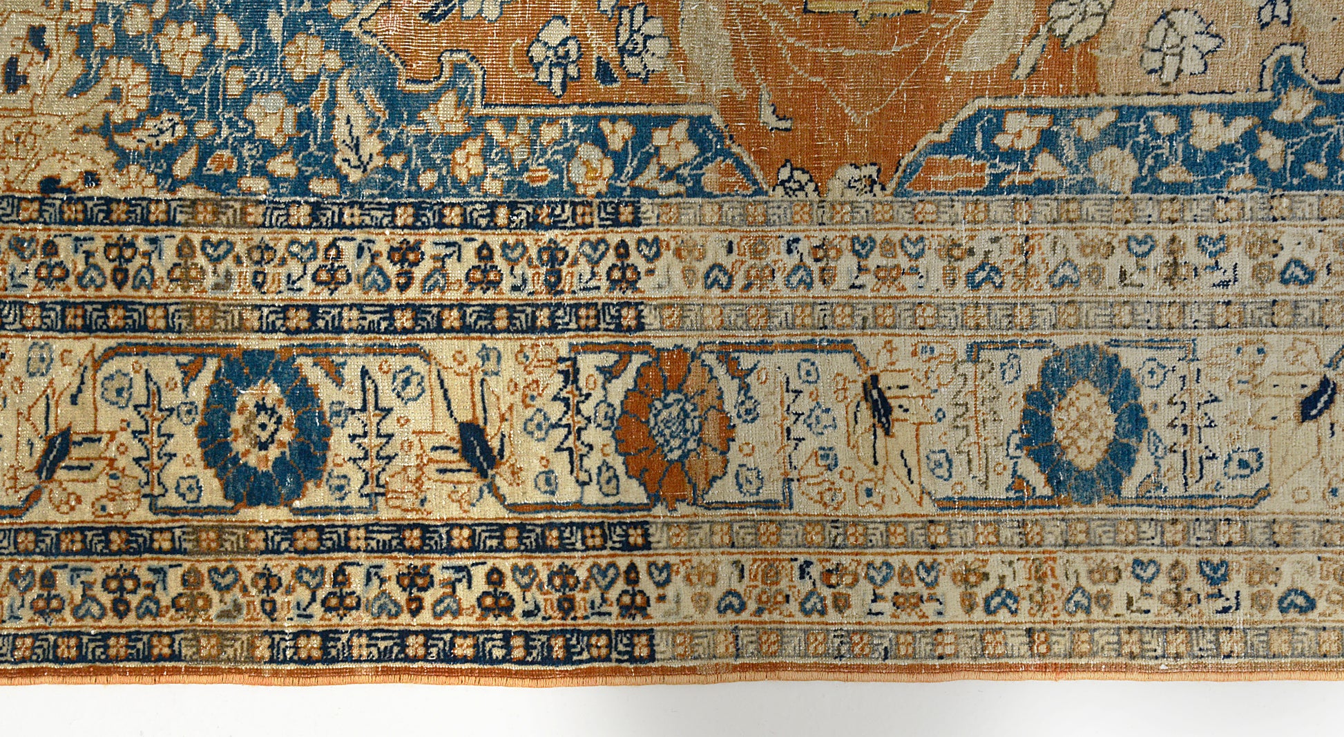 Floral border detail of antique Persian Tabriz rug