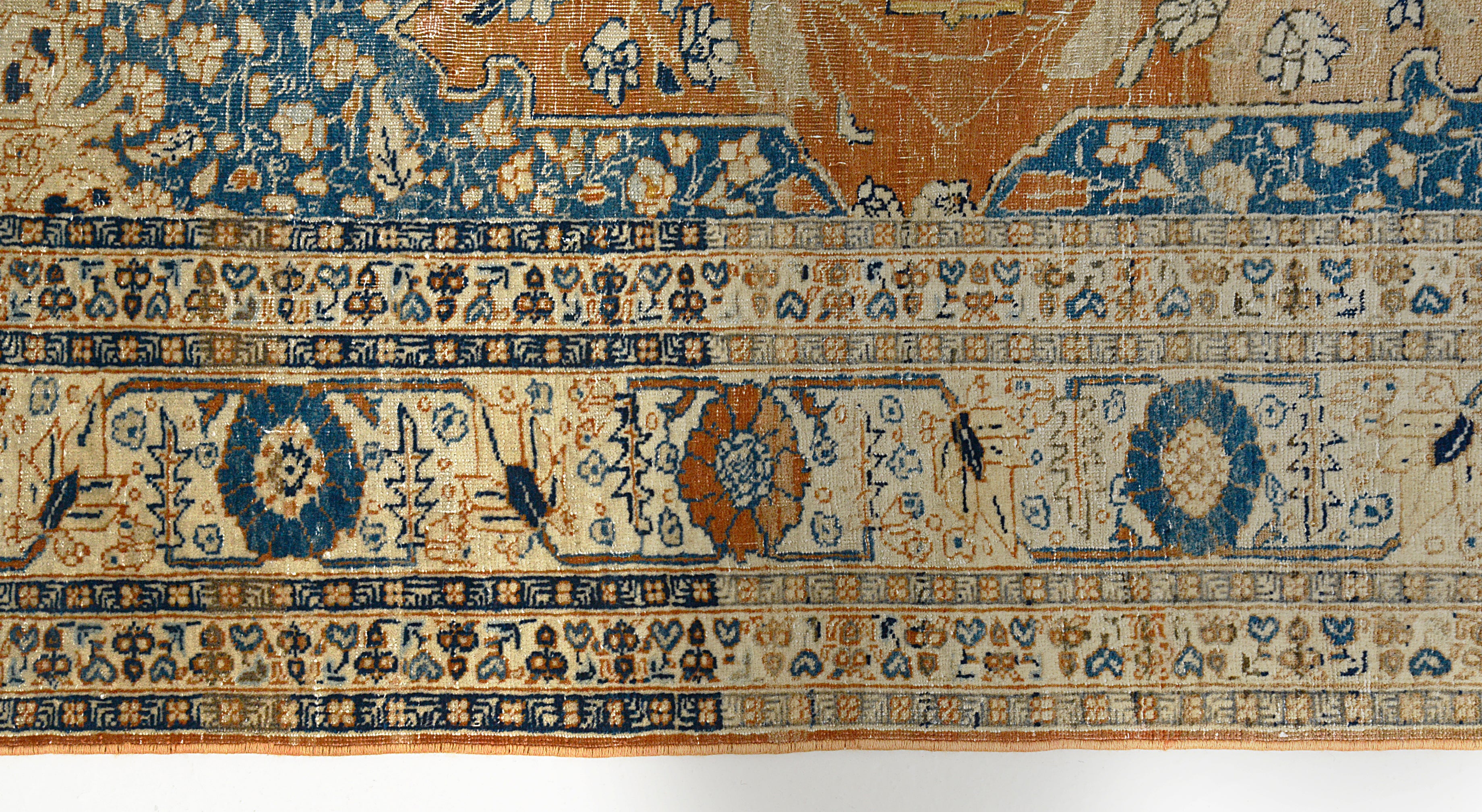 Floral border detail of antique Persian Tabriz rug