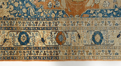 Floral border detail of antique Persian Tabriz rug