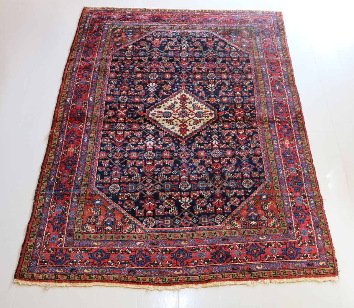Full Hamadan rug showing balanced central medallion and densely patterned field