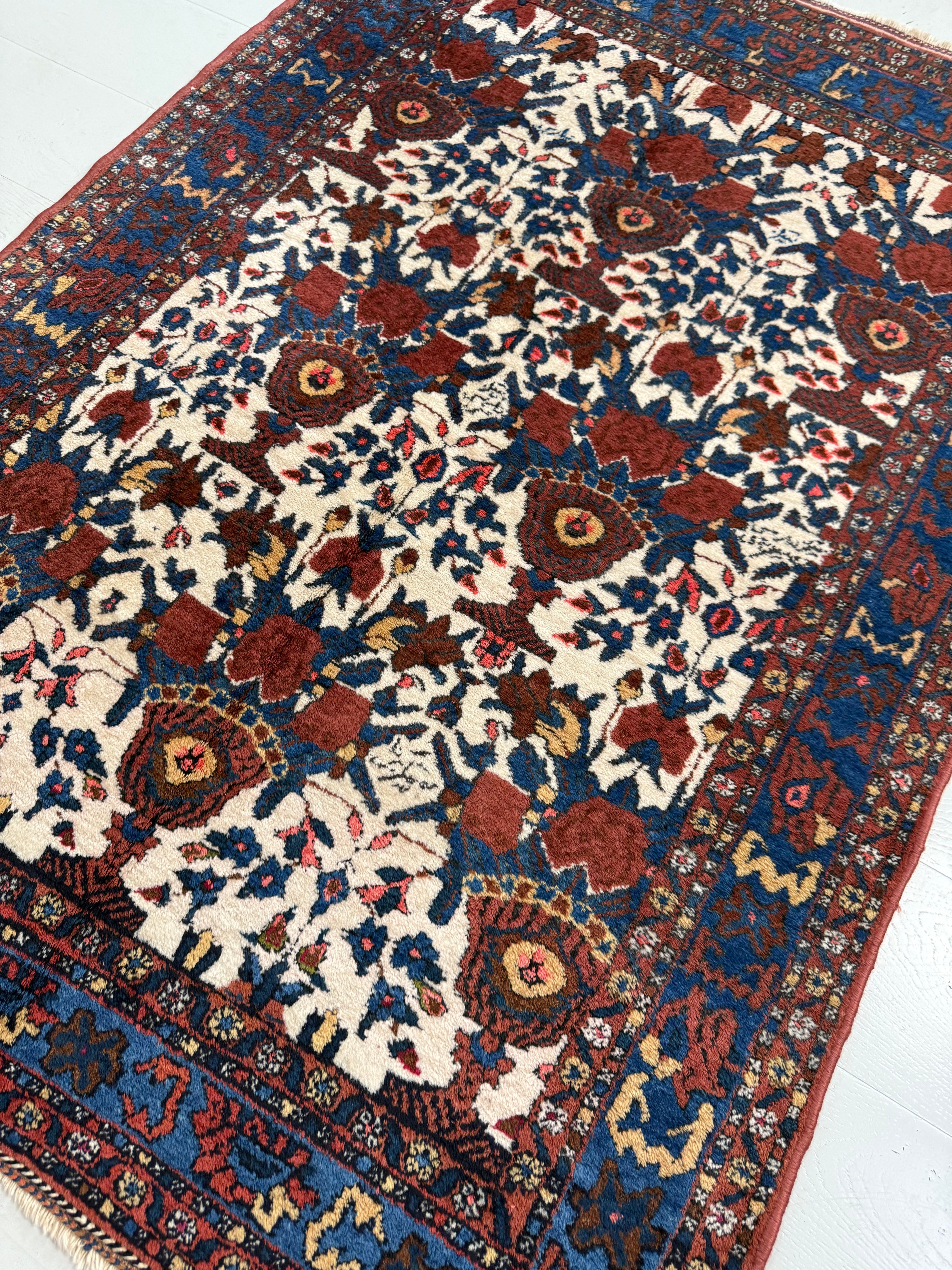 Perspective view of antique Persian Afshar rug on floor
