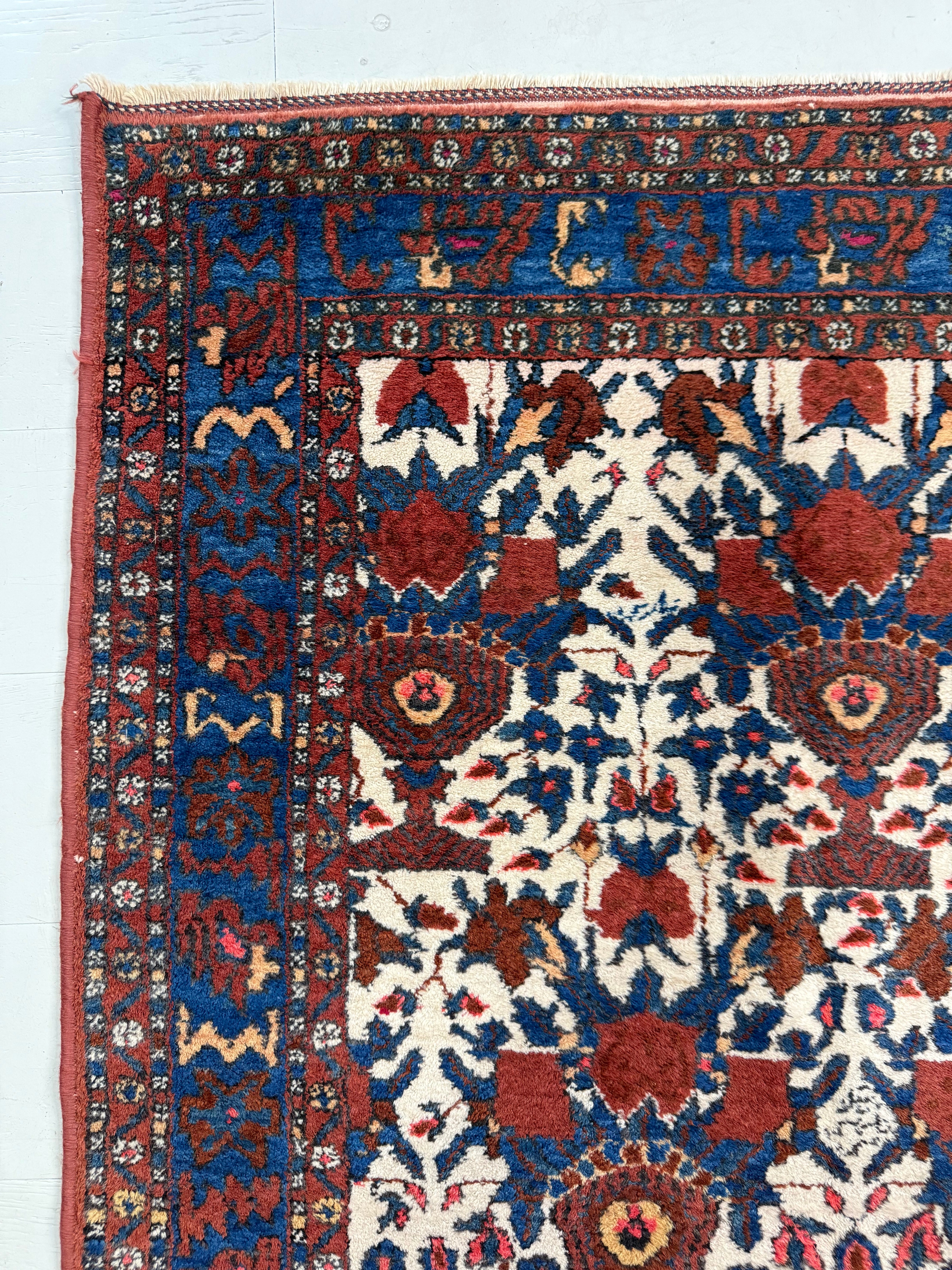 Close-up of central geometric motifs on antique Persian Afshar rug
