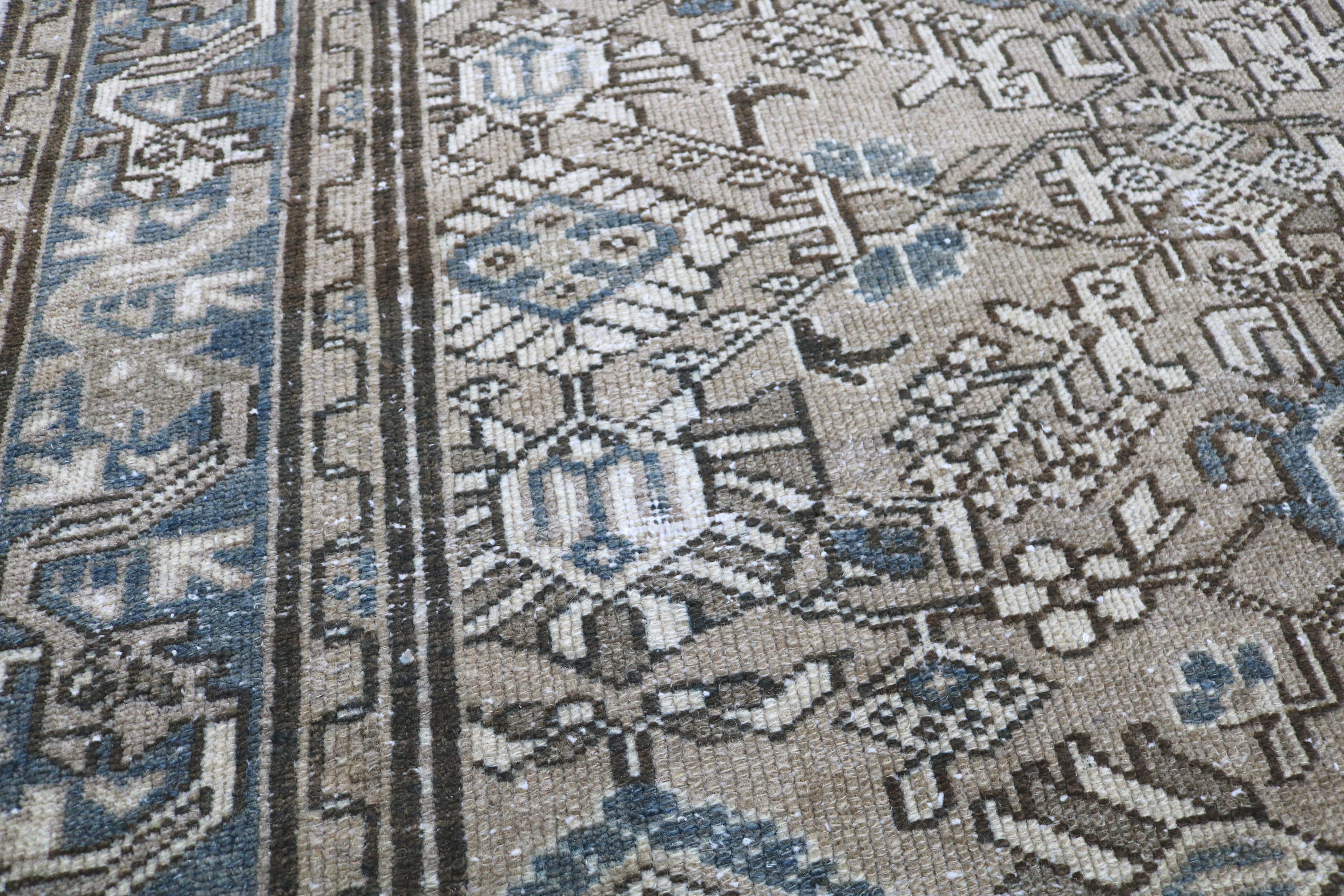 Close-up of hand-knotted wool texture on antique Persian Karaja rug
